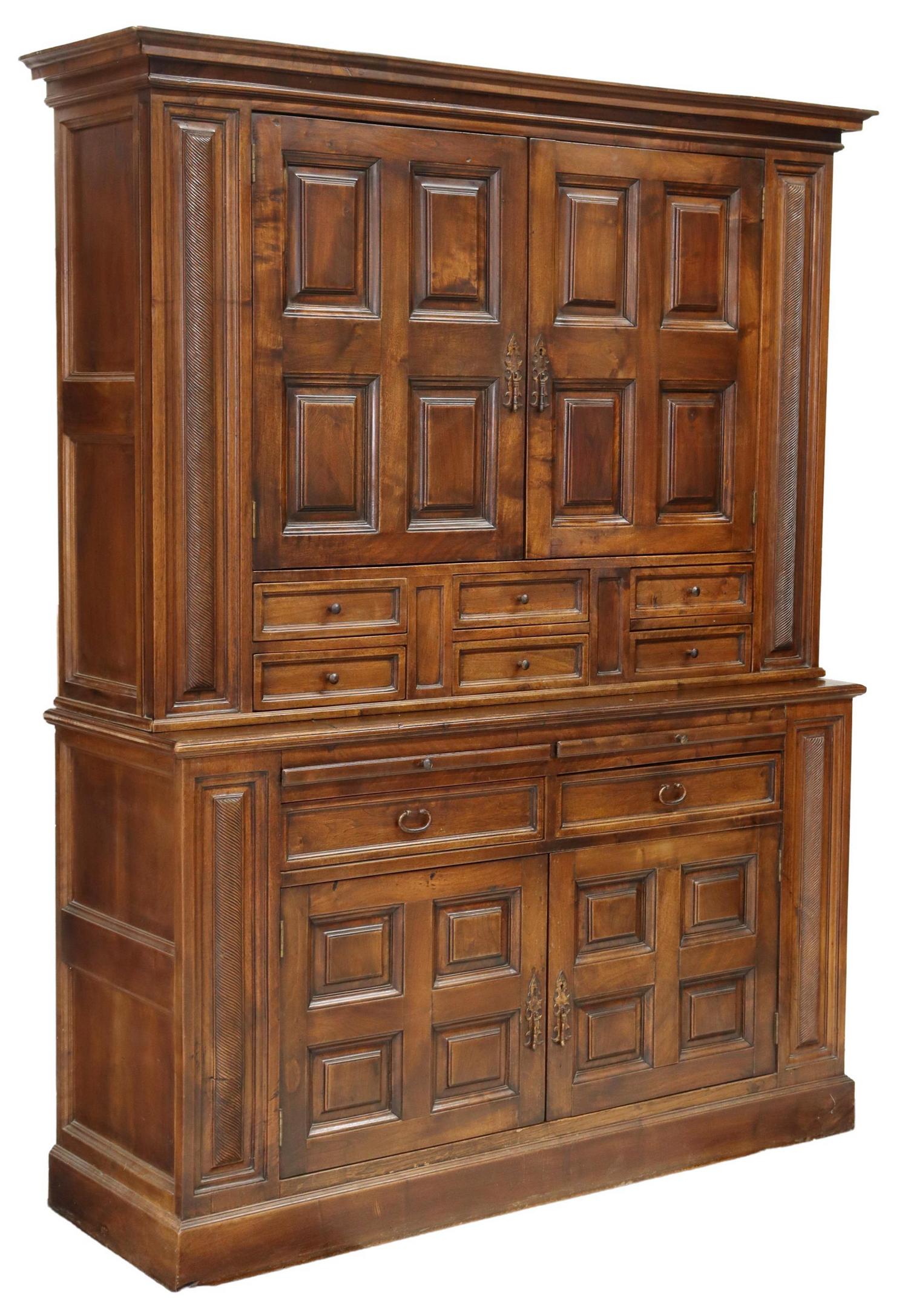 SPANISH BAROQUE STYLE WALNUT STEPBACK CABINET: Spanish Baroque style walnut stepback cabinet, 20th c., molded cornice, upper case fitted with two paneled cabinet doors, opening to interior shelves, over six small drawers, lower case with two pull-