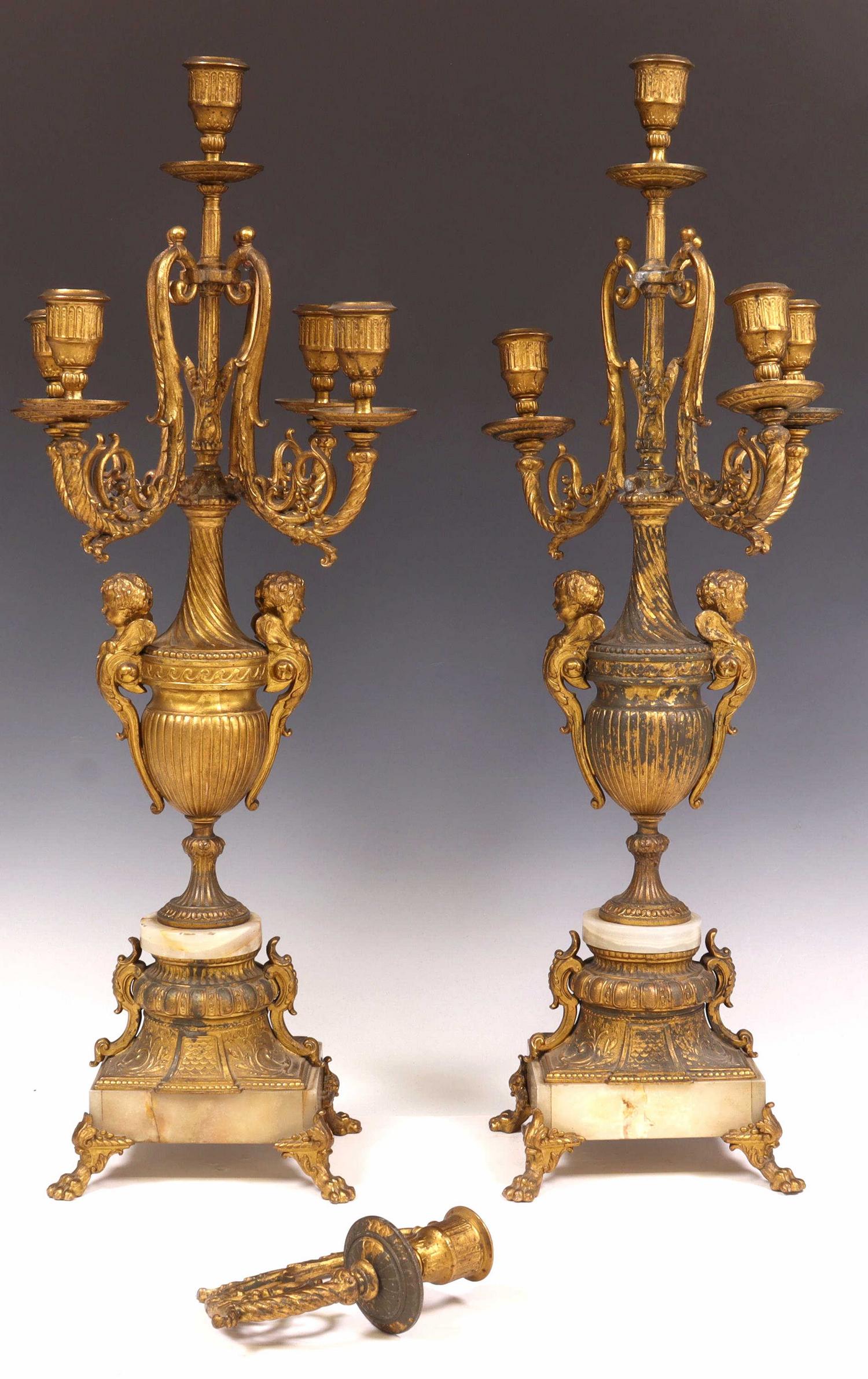 (2) FRENCH LOUIS XV STYLE GILT METAL GIRANDOLES: (pair) French Louis XV style gilt metal candelabra / garnitures, having scrolling foliate arms, issuing five candle cups, over urn-form standard, with winged cherub handles, on onyx pedestal base, end