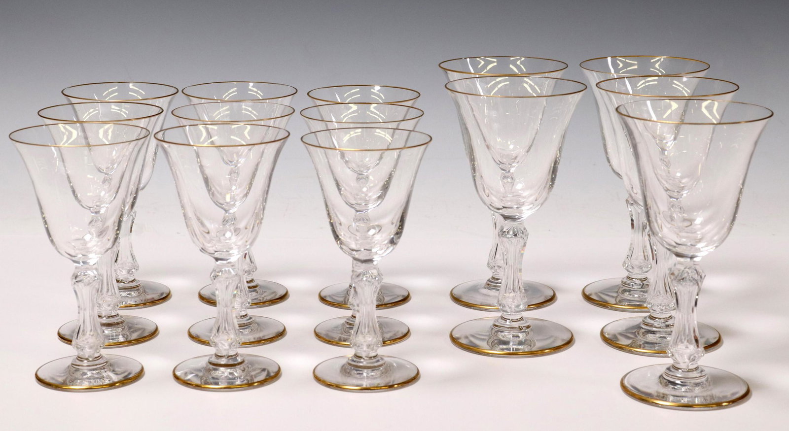 (14) FRENCH ST LOUIS 'LOZERE GOLD' WINE STEMS: (lot of 14) French St Louis "Lozere Gold" crystal stems, plain bowl with gilt rim, cut stem, on a circular foot, acid-etched mark underfoot, including: (5) burgundy wine stems, approx 6.25"h, 3 3/8"di