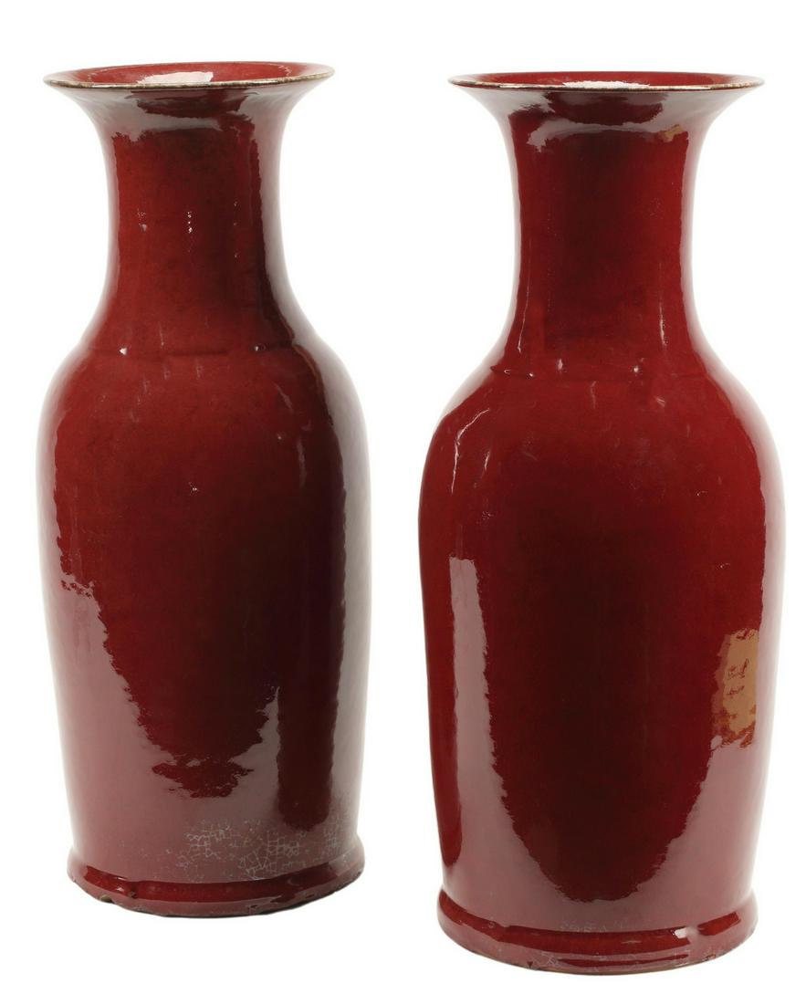 (2) CHINESE SANG DE BOEUF PORCELAIN BALUSTER VASES: (pair) Chinese sang de boeuf (oxblood) porcelain baluster vases, inherent chipping at foot, approx 21.5"h, 8.5"diam Start Price: $400.00