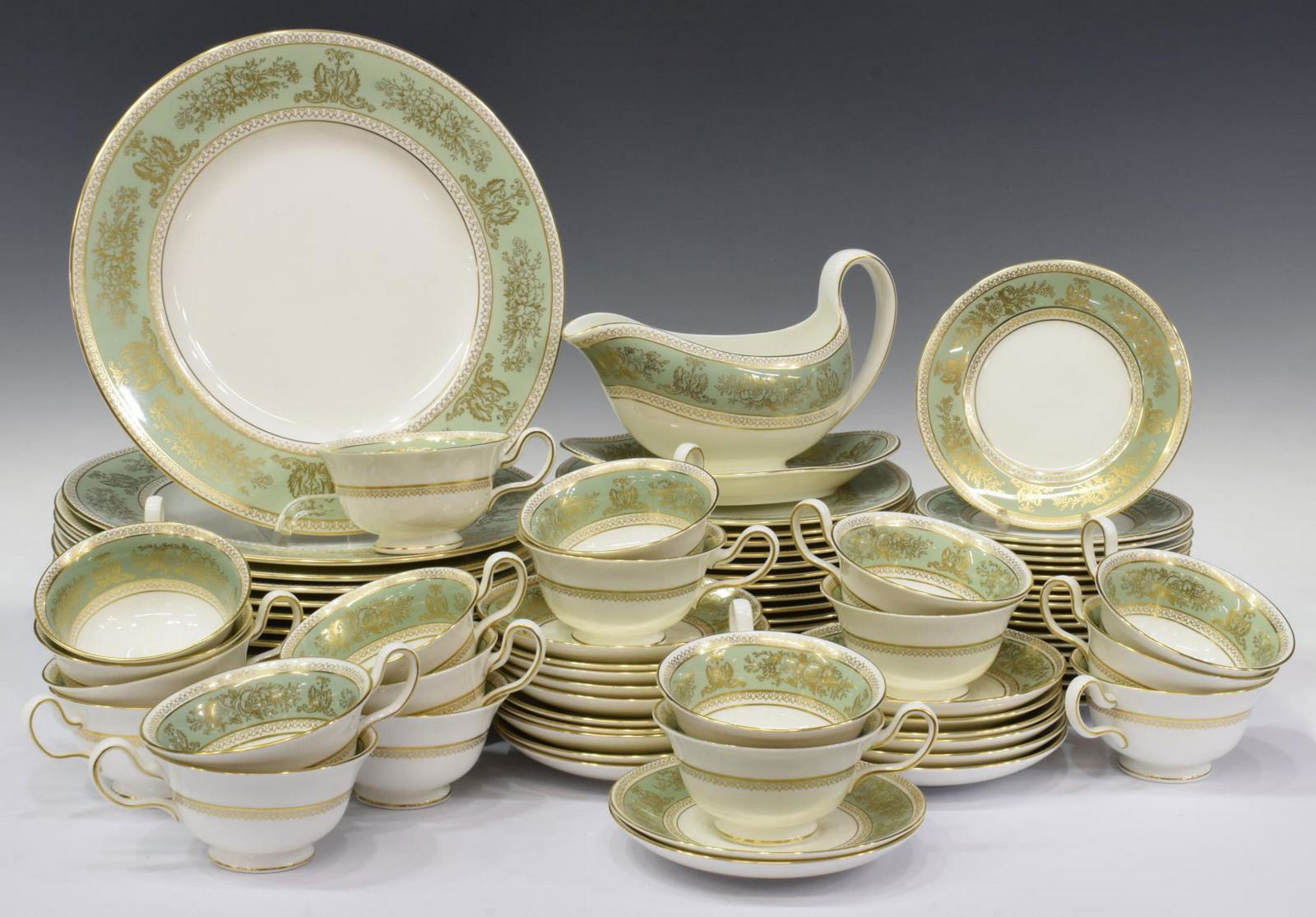 (89) WEDGWOOD GOLD COLUMBIA SAGE DINNER SERVICE: (lot of 89) Wedgwood bone china dinner service, in the "Gold Columbia Sage Green" pattern, with maker's mark underfoot, comprising: (15) dinner plates, approx 10.75"diam; (16) salad plates, approx 8"d