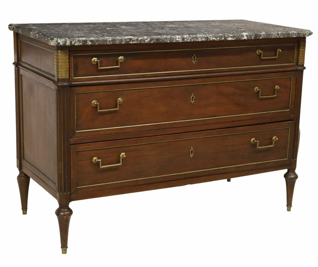 FRENCH LOUIS XVI STYLE MARBLE-TOP MAHOGANY COMMODE: French Louis XVI style marble-top mahogany commode, 19th c., three drawers with gilt metal trim, on tapered legs, separation at right side panel, approx 35.75"h, 51"w, 24"d Start Price: $400.00