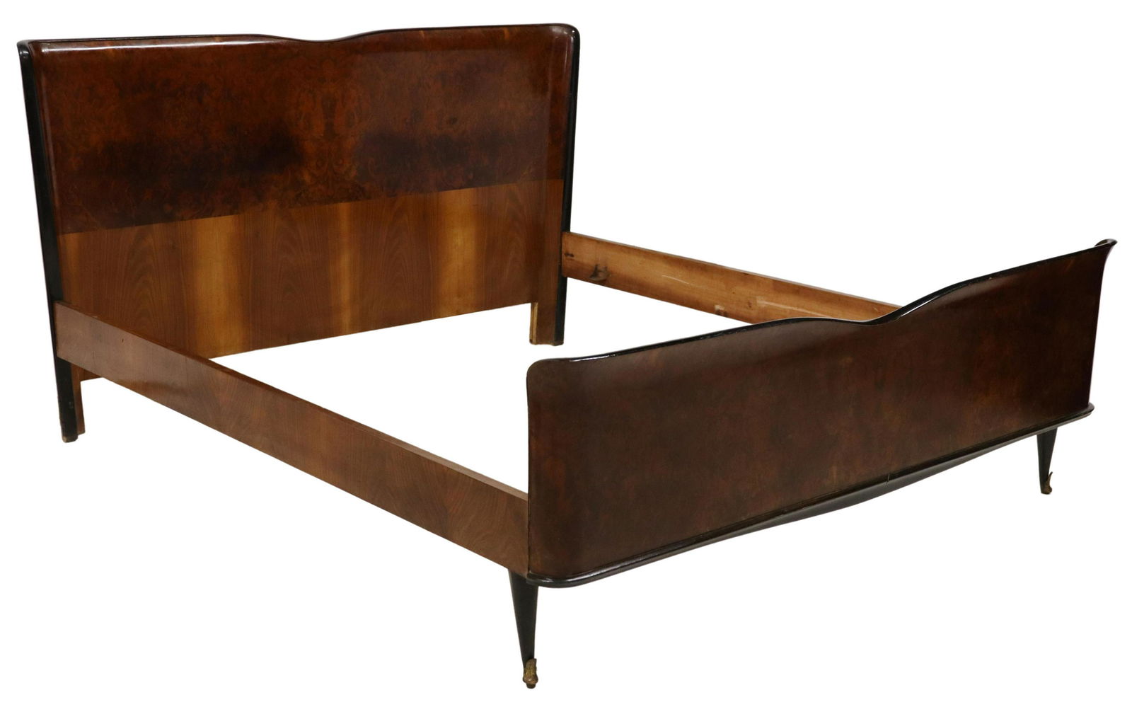 ITALIAN MID-CENUTRY MODERN BURLWOOD BED: Danish mid-century modern matched veneer bed, Hjerm Mobelfabrik, 20th c., having low headboard, rising on contrasting tapered legs, exterior: approx 27"h, 78 5/8"l, 65.25"w, interior: approx 75"l, 63.