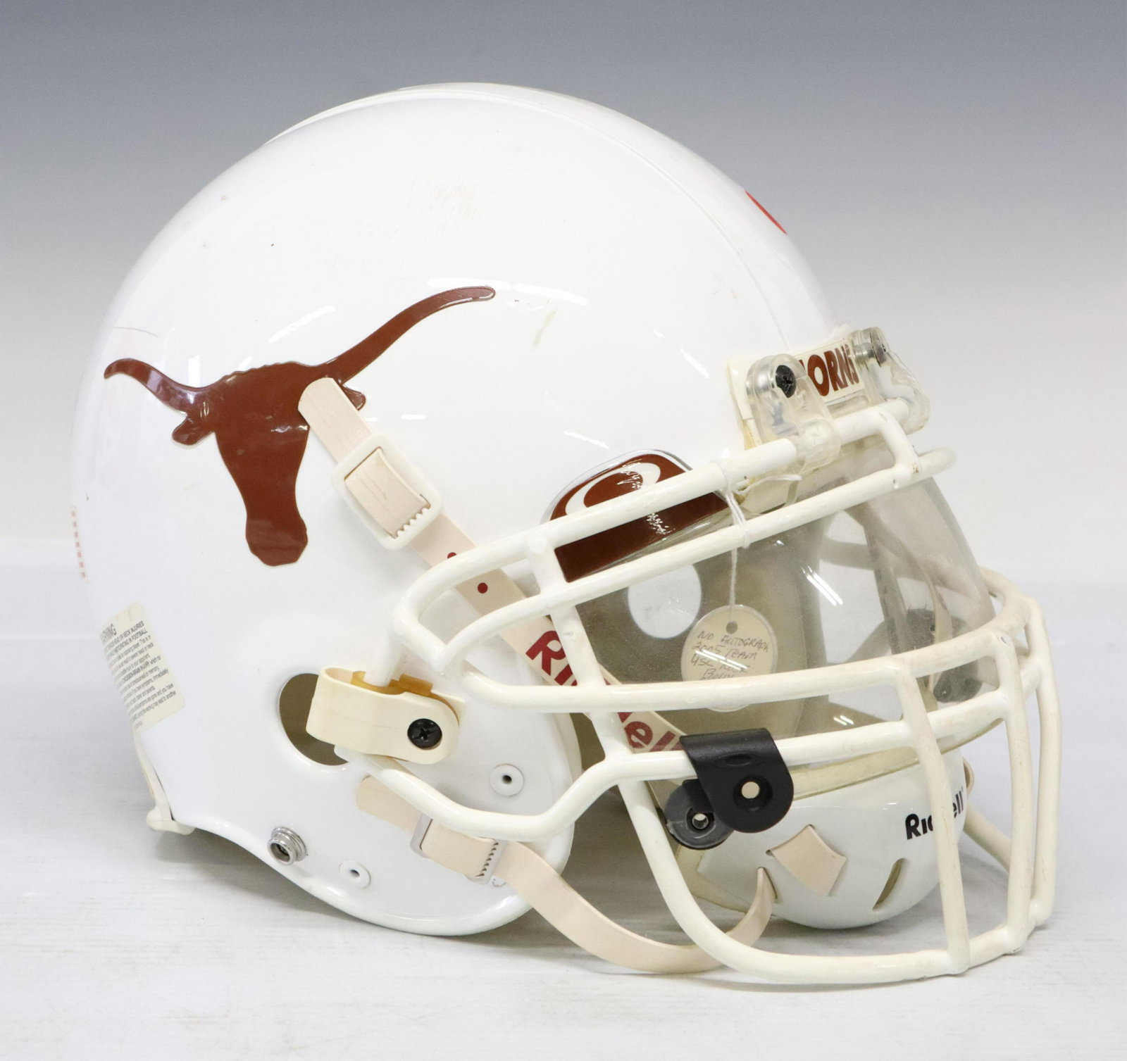 UNIVERSITY OF TEXAS HELMET SIGNED MACK BROWN: University of Texas regulation football helmet signed at the left side signed "Hook Em, Mack Brown", the helmet further identified by our consignor as being game used by Ramonce Taylor (Temple, Texas,