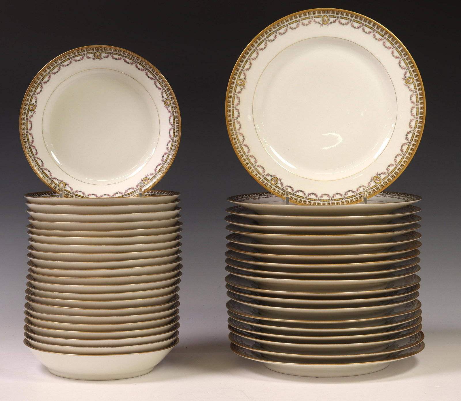 (41) HAVILAND LIMOGES PORCELAIN PLATES & BOWLS: (lot of 41) French Limoges porcelain plates and bowls, Frank Haviland, in the "Schleiger 577" pattern, having parcel gilt trim, floral swag and geometric motifs, maker's mark underfoot, including: (19