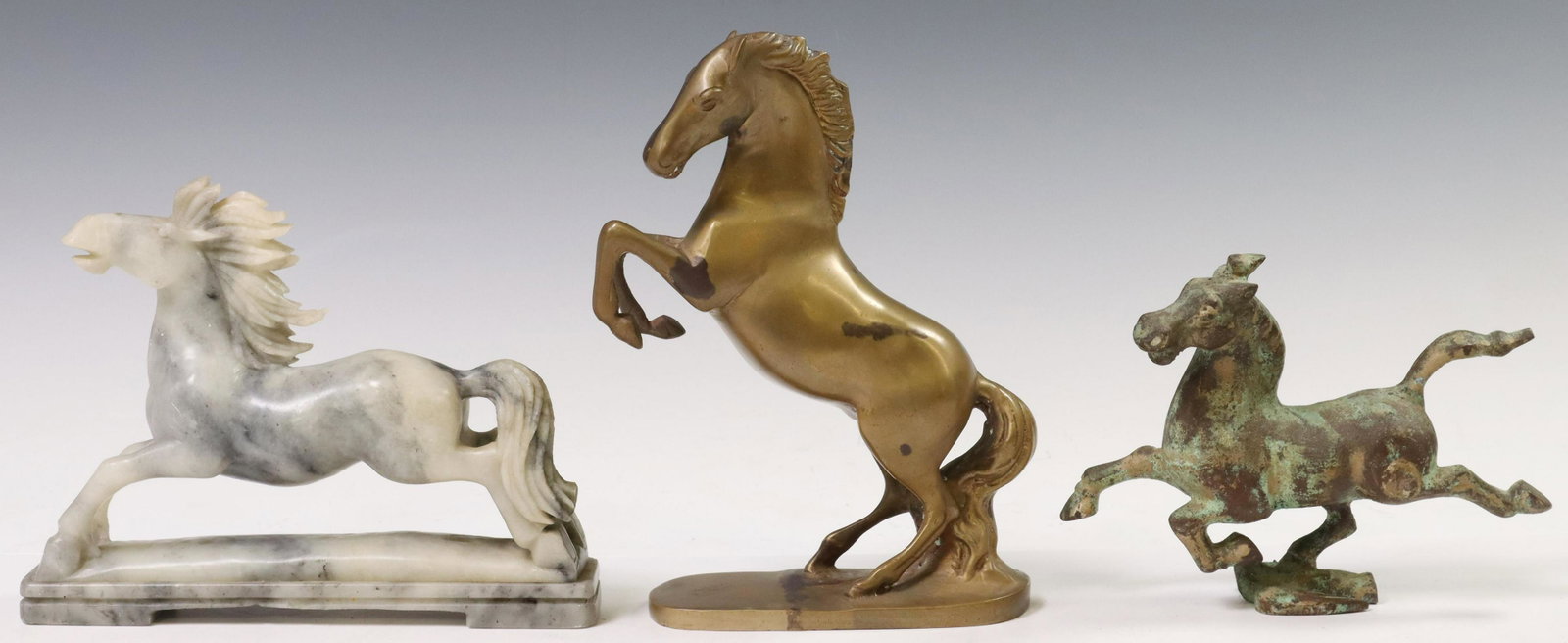 (3) METAL & CARVED ALABASTER EQUINE SCULPTURES: (lot of 3) Equine sculptures, including: (1) patinated metal galloping horse, after the Flying Horse of Gansu, (1) metal rearing horse, (1) carved alabaster running horse, approx 6.75"h, 8.5"l, 1.75"w