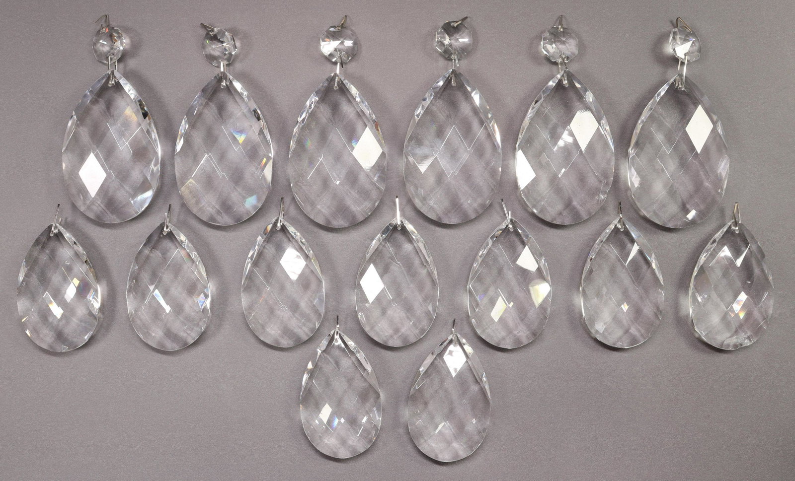 (LOT) CRYSTAL CHANDELIER TEARDROP PENDALOGUES: (lot) Faceted crystal chandelier teardrop pendalogues, some with top bead, parts and pieces, typical small chips, largest: approx 3.5"h, 2.25"w, 3.8lbs total Start Price: $50.00