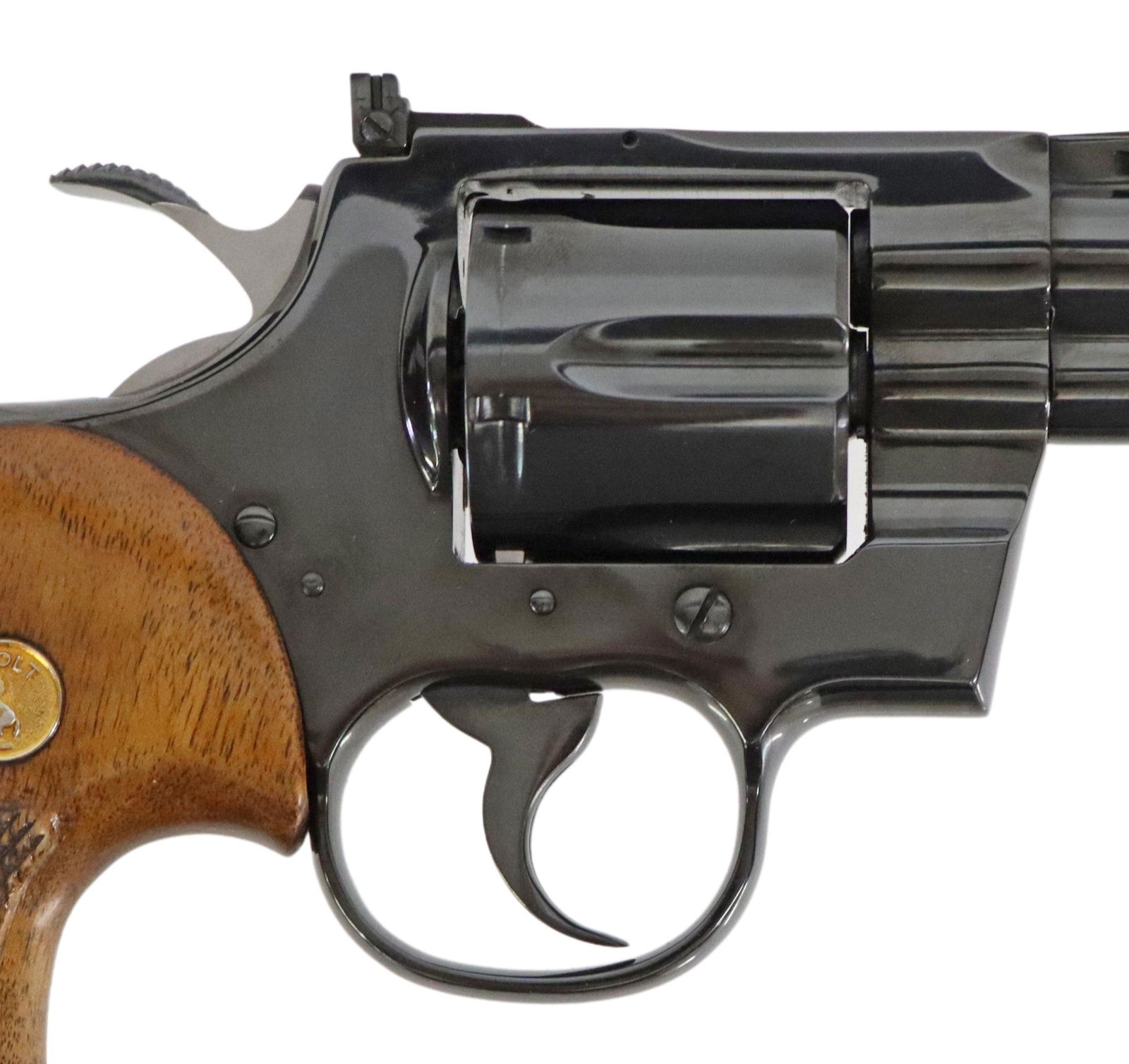 COLT PYTHON .357 CALIBER REVOLVER & BOX, 98%+: Colt Python Double Action Revolver, mfg 1977, .357 caliber, 4" vent rib barrel, fixed front sight, adjustable rear sight, 6 round swing out cylinder, checkered wood logo grips, original box in worn co