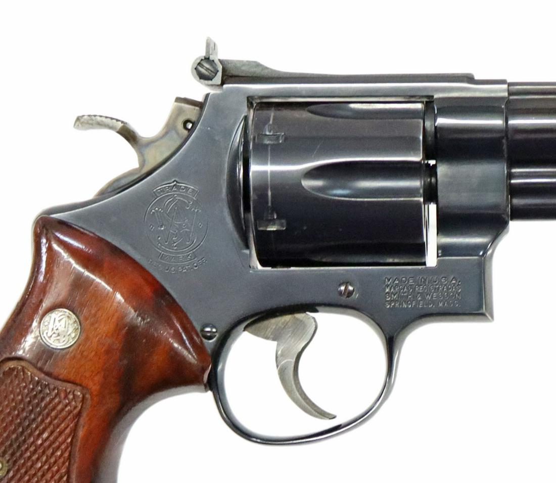 SMITH & WESSON 29-3 REVOLVER 44 MAGNUM, 10" BARREL: Smith & Wesson Model 29-3 revolver, .44 Magnum caliber, 10.5/8" barrel, adjustable blade front sight, adjustable rear sight, six round cylinder, checkered wood logo grips, action is good, may be sligh