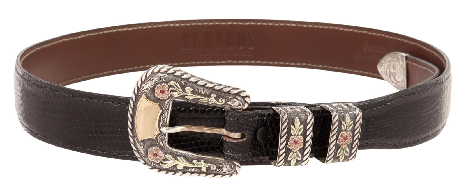 R. SCHAEZLEIN SAN FRANCISCO RUBY RANGER BUCKLE SET: Western gent's four-piece sterling silver and 14kt gold ranger buckle set, R. Schaezlein & Son, rope edge, gold overlay flowers set with rubies, (one) buckle, approx 2 3/8"l, 2.25"w, (two) keepers, (o