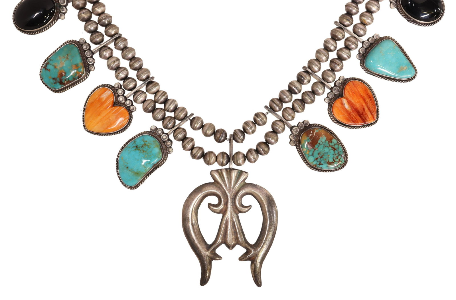 FRANCIS L. BEGAY NAVAJO STERLING SQUASH BLOSSOM: Native American sterling silver squash blossom necklace, Francis L. Begay (Navajo/ Dine, 20th c.), ten blossoms set with turquoise, onyx, and heart-shaped spiny oyster shell, central tufa cast naja pe