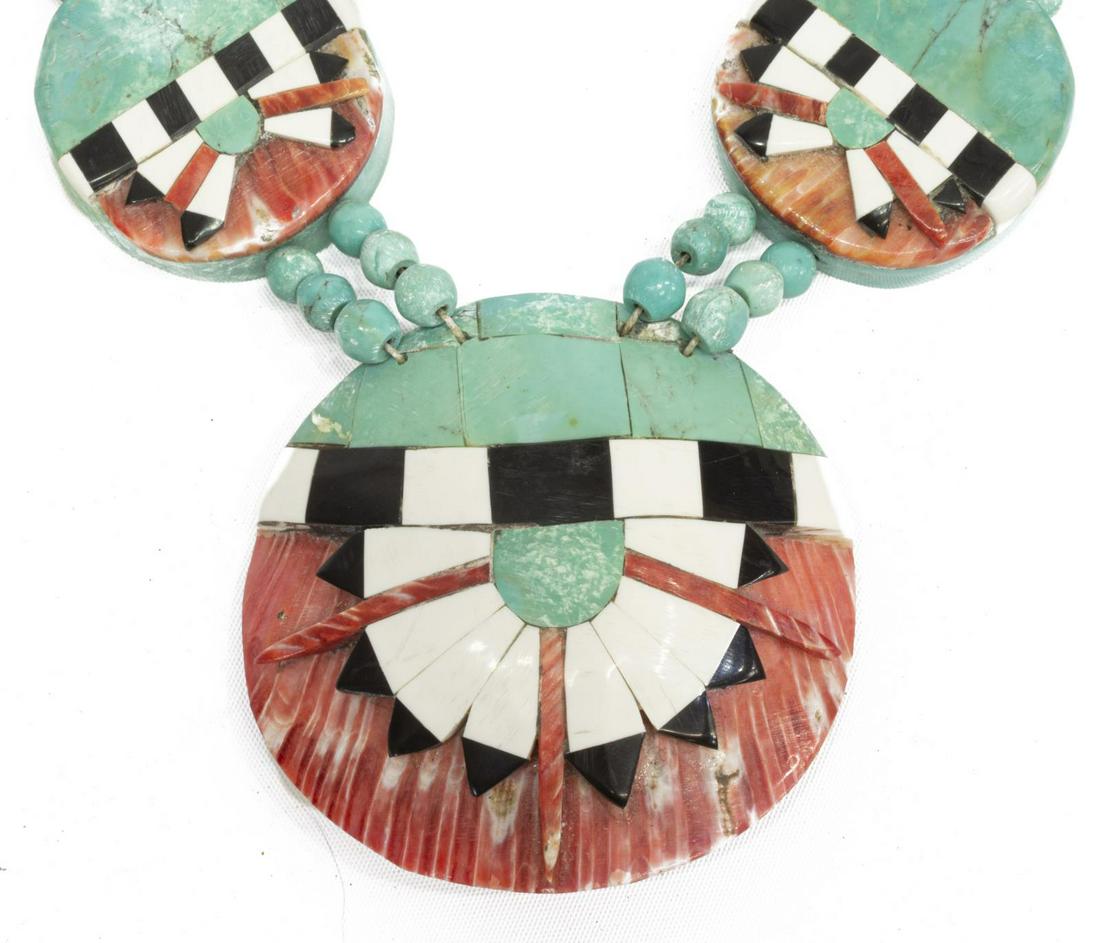 SANTO DOMINGO PUEBLO DISC & SHELL NECKLACE: Native American beaded necklace, attributed by consignor to Cipriano Garcia, Santo Domingo Pueblo, eight disc beads inlaid with spiny oyster shell, central shell pendant approx 2 7/8"h, 3"w, unsigned,