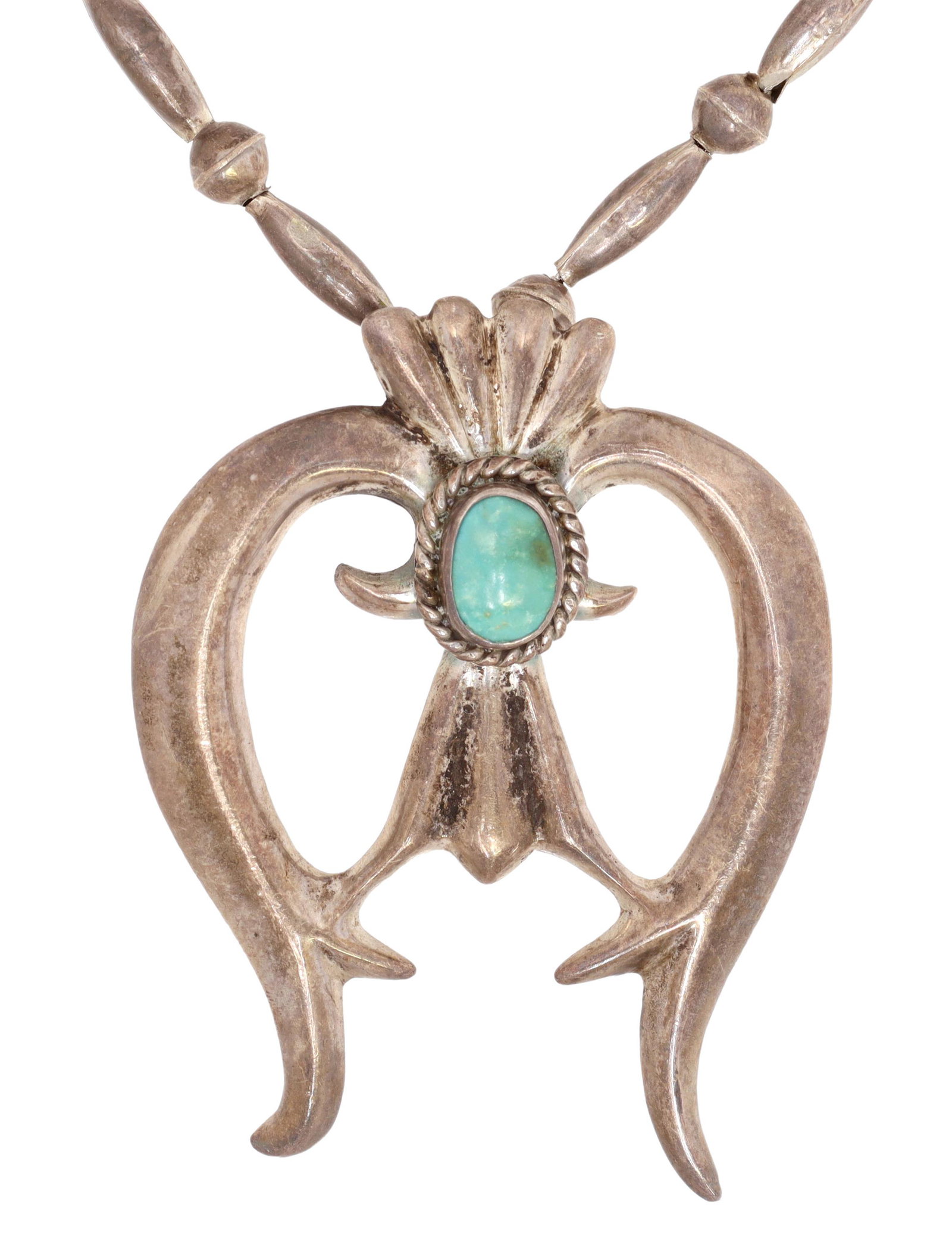 NATIVE AMERICAN SILVER & TURQUOISE NAJA NECKLACE: Native American silver (content unknown) necklace, likely Navajo/ Dine, tufa cast naja pendant set with a turquoise cabochon, on a bench bead strand with round and oblong beads, hook closure, pendant: