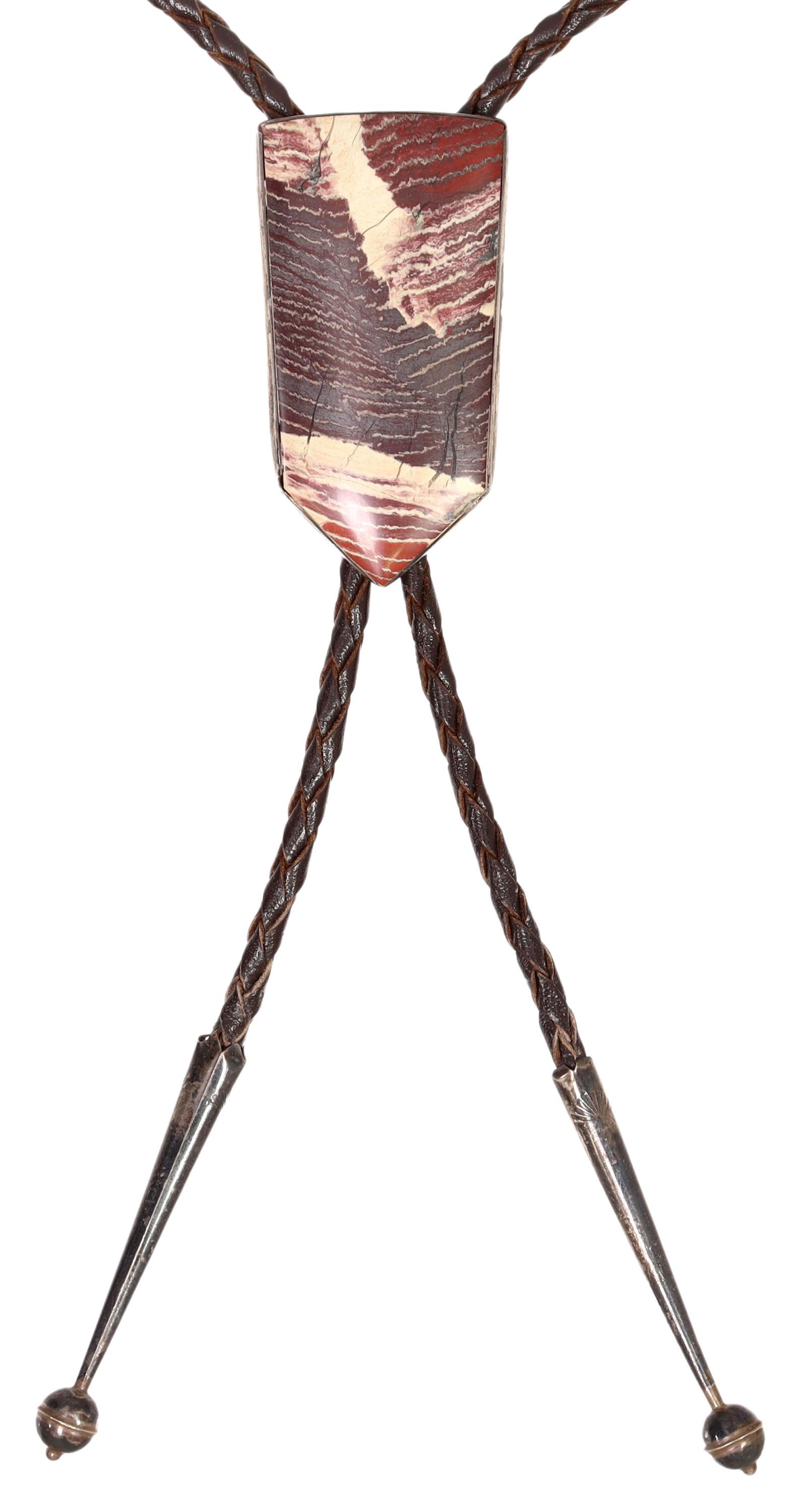 SOUTHWEST AUBREY ROPER STERLING & JASPER BOLO TIE: Southwest hand-made sterling silver bolo tie, Aubrey Roper, bezel-set jasper plaque, silver (content unknown) bolo tips, braided brown leather cord, bolo ornament only: approx 2.5"h, 1.25"w, 51.5 gram