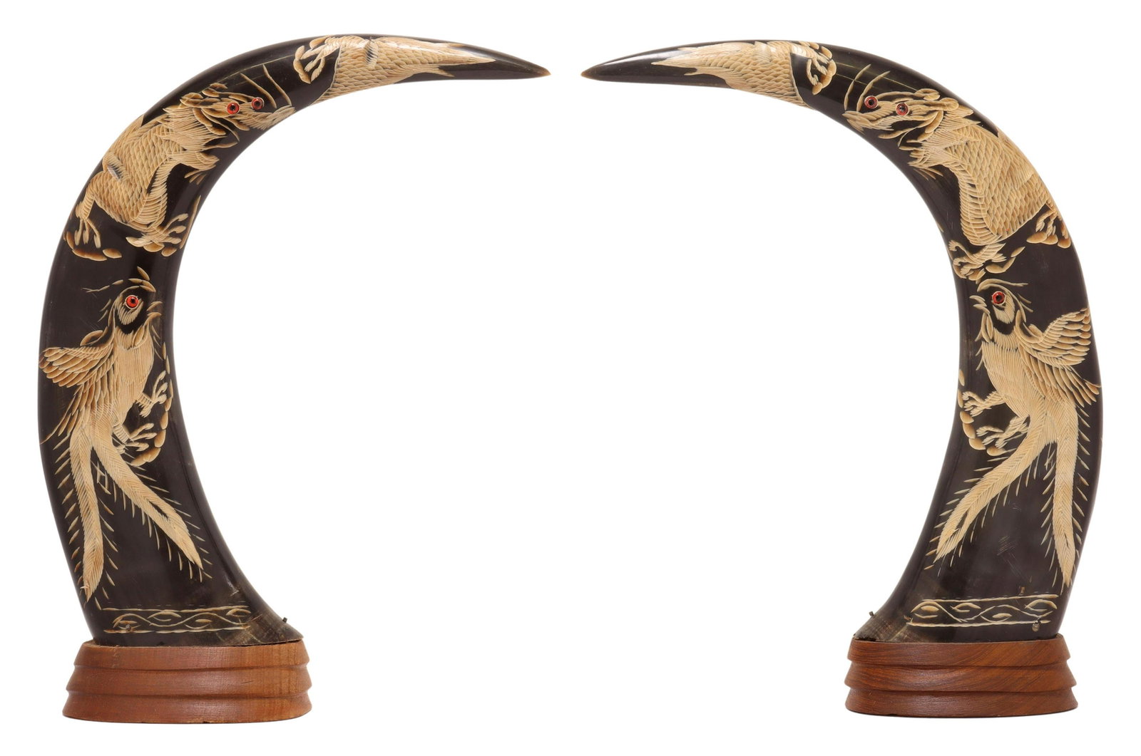 (2) PHOENIX & DRAGON CARVED BUFFALO HORN MOUNTS: (lot of 2) Water buffalo horn mounts, Southeast Asia, 20th c., carved phoenix and dragon with inset eyes, mounted to a wood base, approx 14"h, 10 5/8"w, 3 3/8"d **Provenance: from the estate of a Texa