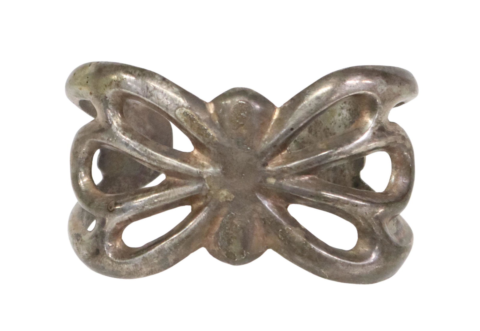 E.S. MITCHELL NAVAJO TUFA CAST COIN SILVER CUFF: Native American tufa cast coin silver cuff bracelet, E.S. Mitchell (Eugene S. Mitchell, 20th c.), Navajo/ Dine, typical openwork design, approx 1 5/8"w, interior: 5.5"l, gap: approx 7/8"w, 2.17ozt Sta
