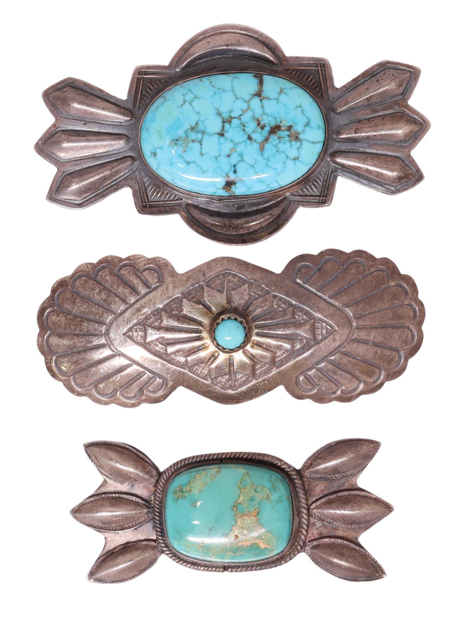 (3) NAVAJO SILVER & TURQUOISE BROOCHES, BARRETTE: (lot of 3) Native American silver jewelry, likely Navajo/ Dine, including: (1) sterling silver brooch, Paul J. Begay (b. c.1965), central turquoise cabochon, approx 2 5/8"l, 1.5"w, (1) silver (content