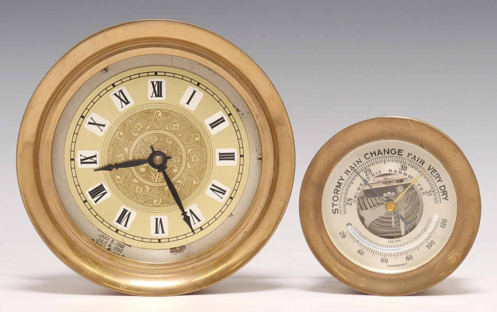 (2) BRASS-CASED CLOCK & CHELSEA BAROMETER: (lot of 2) Brass-cased instruments, including: (1) Chelsea Clock Company holosteric barometer and thermometer, glass fractured, approx 3.25"h, 4 7/8"diam, (1) Star Brass Manufacturing Company gauge, n
