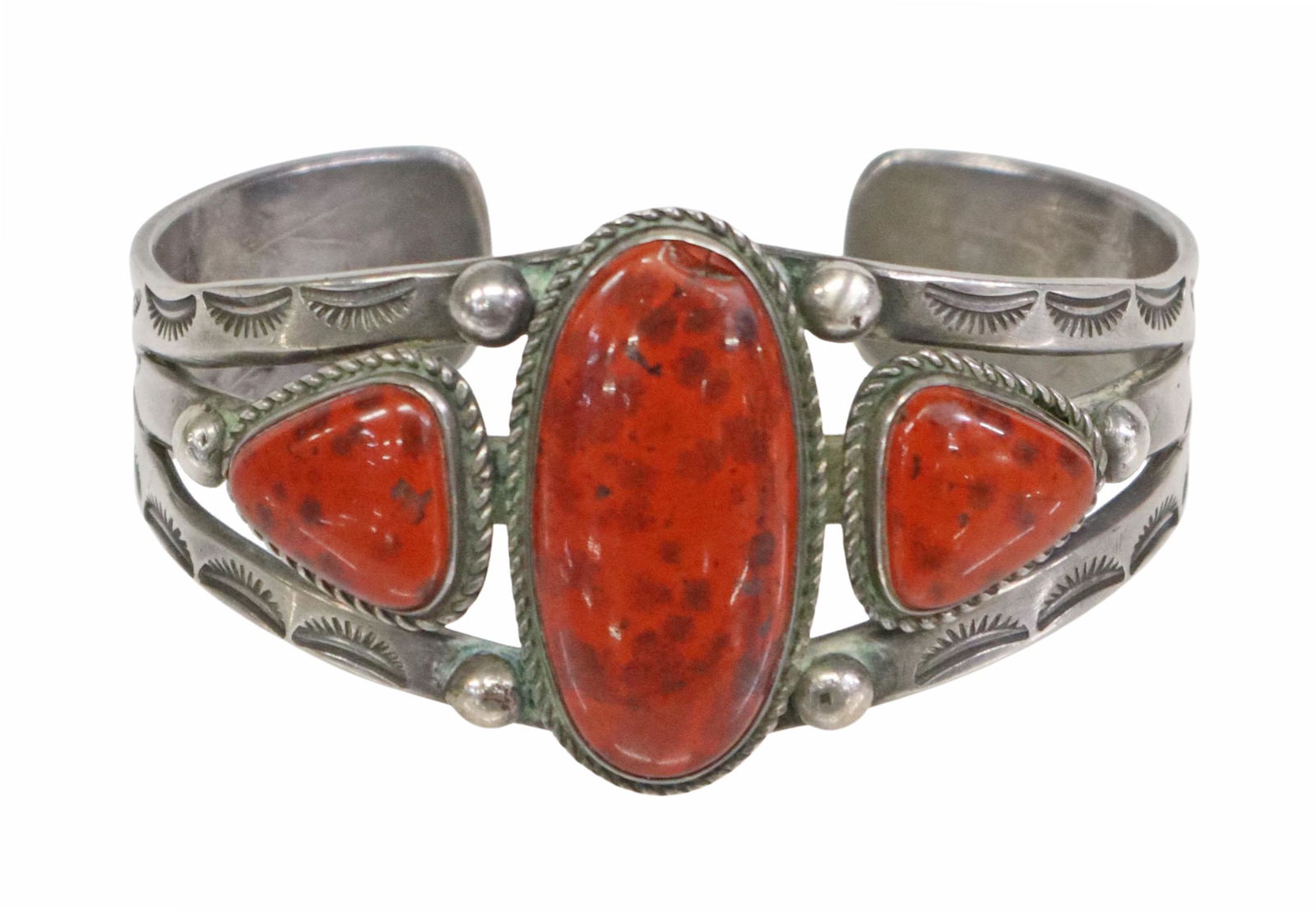 SOUTHWEST STERLING JASPER & STAMPWORK CUFF: Southwest sterling silver cuff bracelet, three bezel-set red jasper cabochons, twisted wire rope borders, shoulders with stamped designs, approx 1 3/8"w, interior: 5.75"l, gap: approx 7/8"w, 53.6 gram