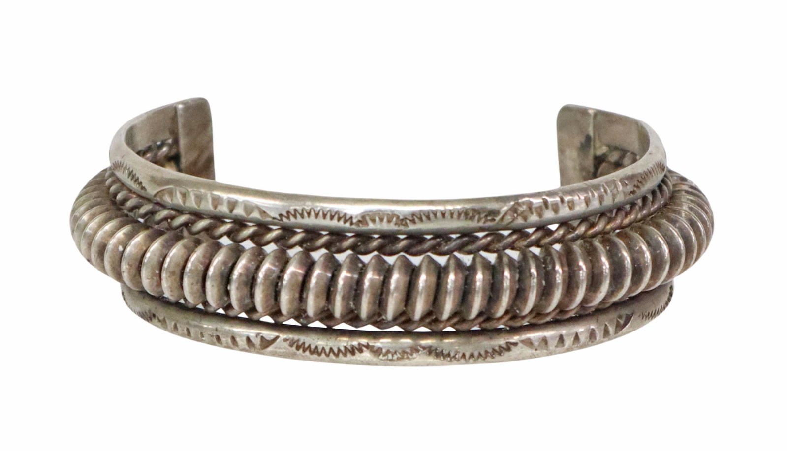 SOUTHWEST SILVER TWISTED WIRE CUFF BRACELET: Southwest silver (content unknown) cuff bracelet, stamped designs, center rope twist and coiled wires, approx 0.75"w, interior: 5 1/8"l, gap: approx 1.5"w, 1.86ozt Start Price: $50.00