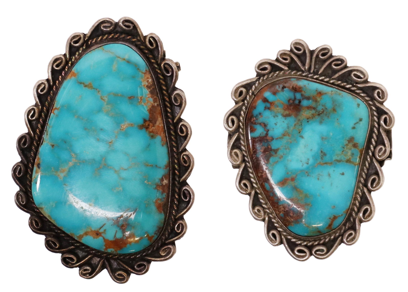 (2) MT NATIVE AMERICAN TURQUOISE & SILVER PENDANTS: (lot of 2) Native American turquoise and silver (content unknown) pendant elements, likely Melvin Thompson (Navajo), bezel-set stone with rope and scroll border, both with dual channels to back, large