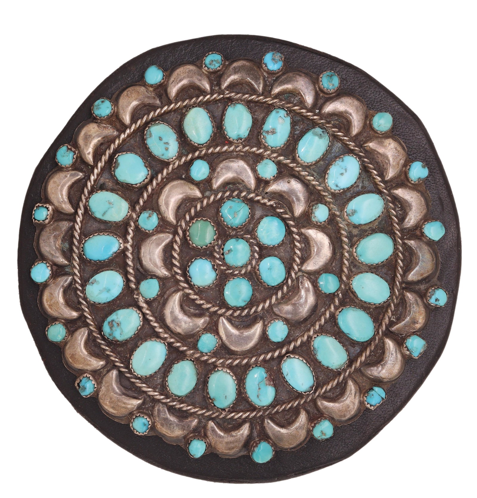 NATIVE AMERICAN PETIT POINT TURQUOISE CONCHO: Native American petit point turquoise and silver (content unknown) concho belt element, round form, with concentric bands of crescent moons and rope accent, incised marks to back B/L and SW inside a p