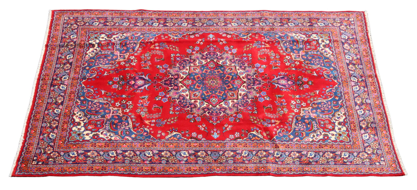 HAND-TIED PERSIAN MASHAD RUG, IRAN, 11'3" X 8'0": Persian hand-tied wool Mashad rug, Iran, retaining maker's tag at corner, approx 11'3"l, 8'0"w **Provenance: From a fine Texas estate** **Please Note: All of the rugs offered in this auction would lik
