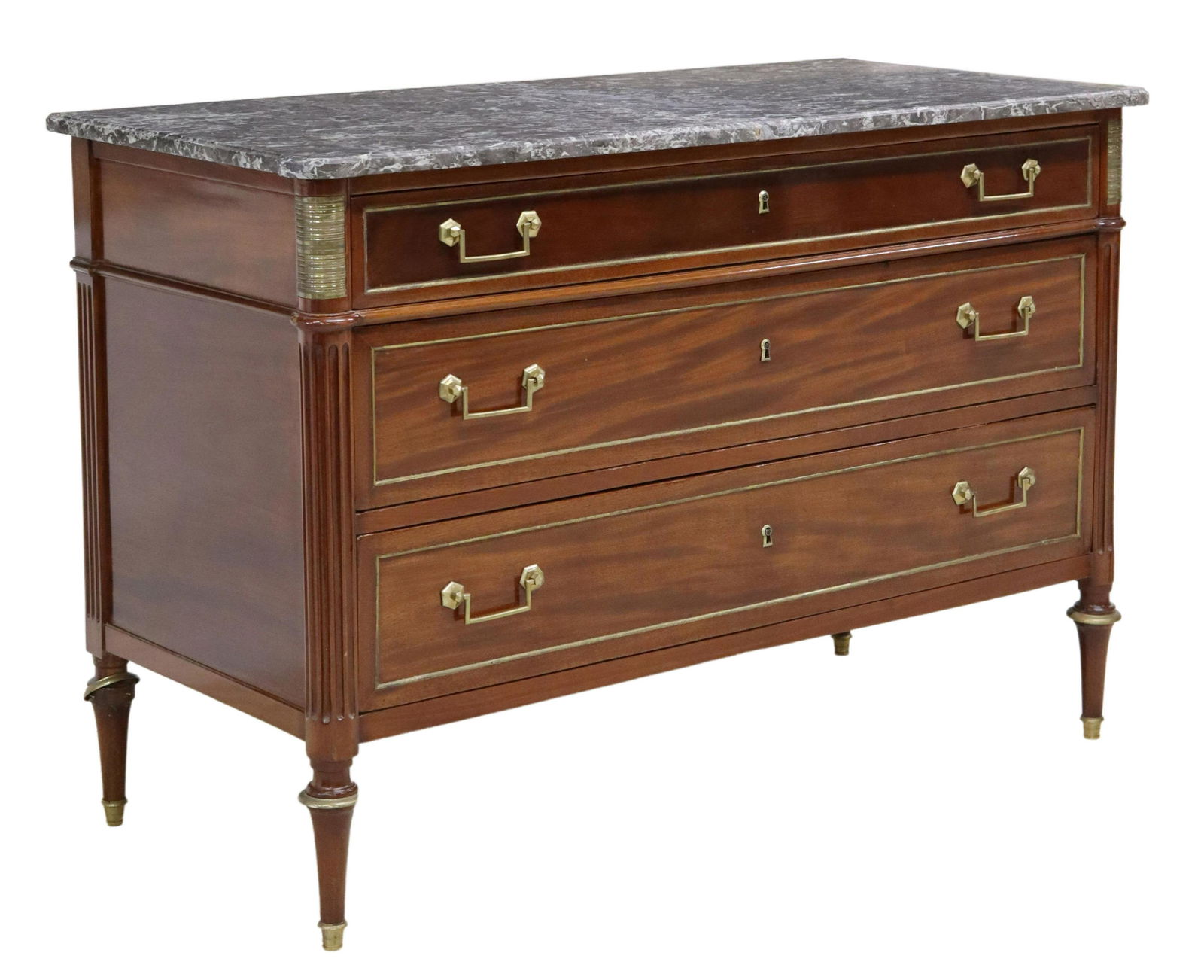 FRENCH LOUIS XVI STYLE MARBLE-TOP MAHOGANY COMMODE: French Louis XVI style mahogany commode, late 19th c., having shaped marble top, over three drawers, upper drawer revealing divided interior, fluted corner posts, rising on tapered legs, ending on bra