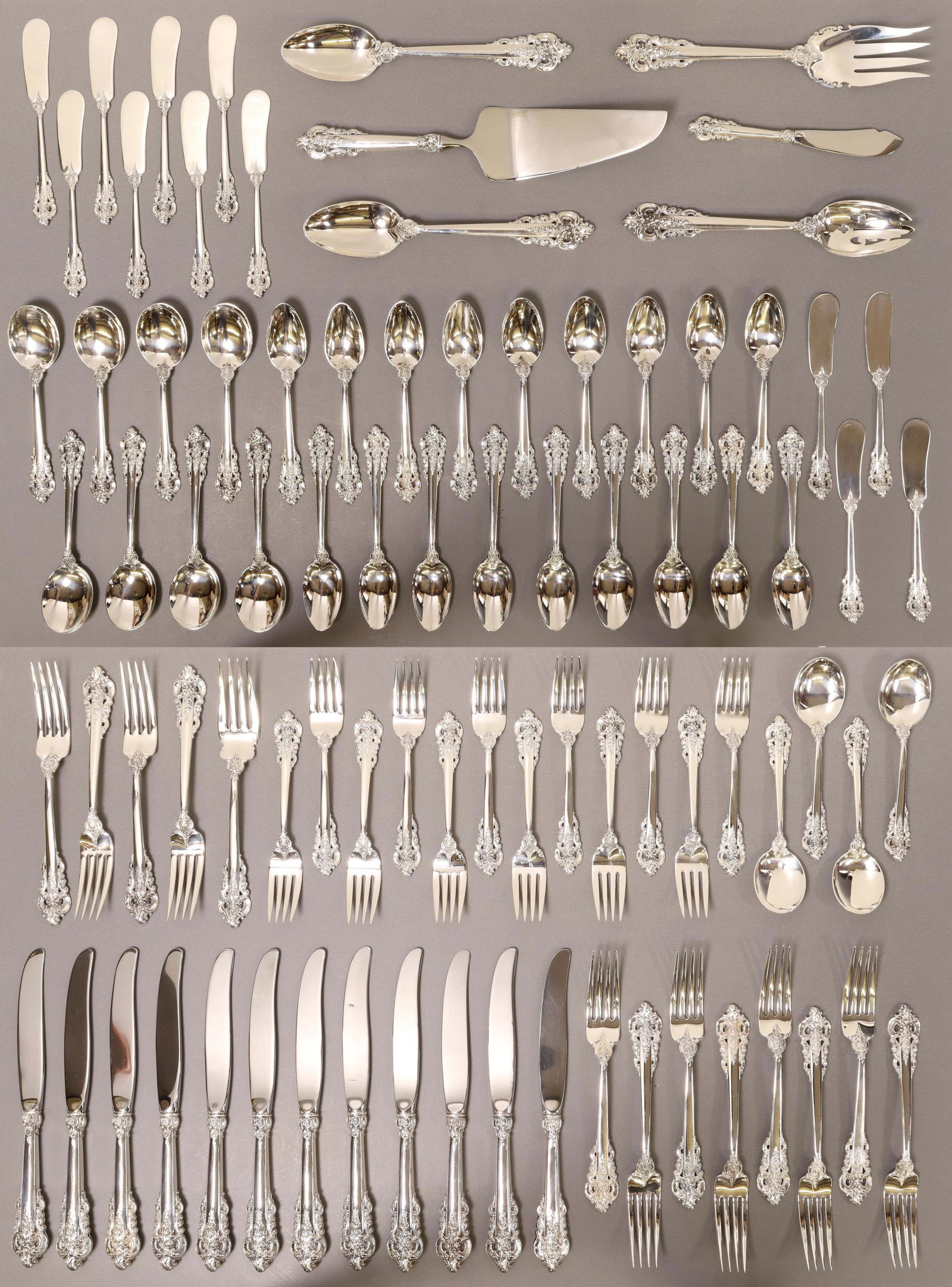 (85) WALLACE GRANDE BAROQUE STERLING FLATWARE SET: (lot of 85) American sterling silver flatware service, Wallace Silversmiths, in the "Grande Baroque" pattern, service for twelve, including: (12) hollow handle knives, 9.75"l, (12) flat handle butter