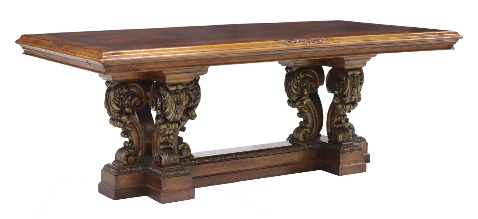 BAROQUE STYLE CROSSBANDED TABLE: Baroque style table, 20th c., crossbanded tabletop, volute supports with parcel gilt fruit festoons, on a stepped plinth, approx 31.75"h, 86.5"l, 43"w, clearance: approx 27.25"h Start Price: $800.00