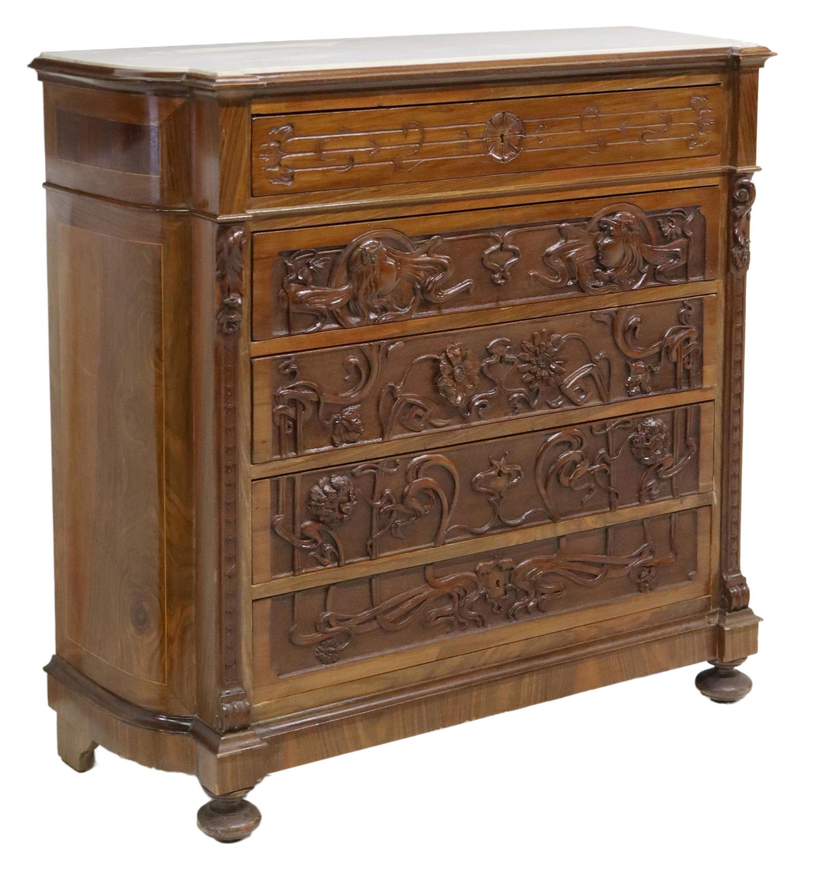 ITALIAN ART NOUVEAU WHIPLASH CARVED COMMODE: Italian Art Nouveau carved commode, early 20th c., having shaped marble top, over case heavily carved in whiplash, foliates, and female mask motifs, fitted with five drawers, rising on bun feet, appro