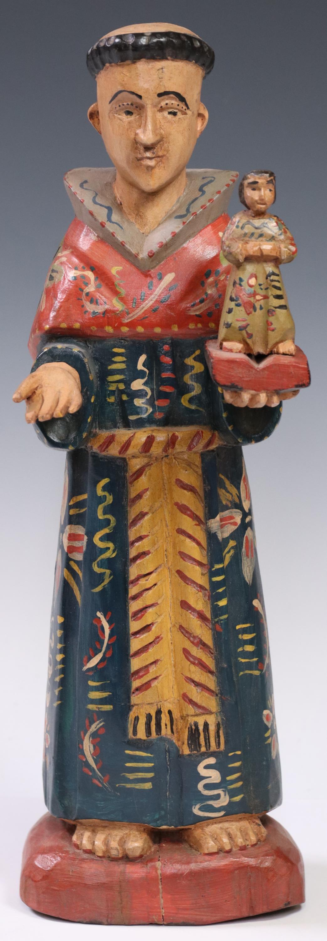 CARVED & PAINTED WOOD SANTO SAN ANTONIO DE PADUA: Carved and painted wood santo, San Antonio de Padua (Saint Anthony of Padua), depicted holding the Christ Child and open bible, approx 14"h, 4.5"w, 3.5"d, 2lbs Start Price: $80.00