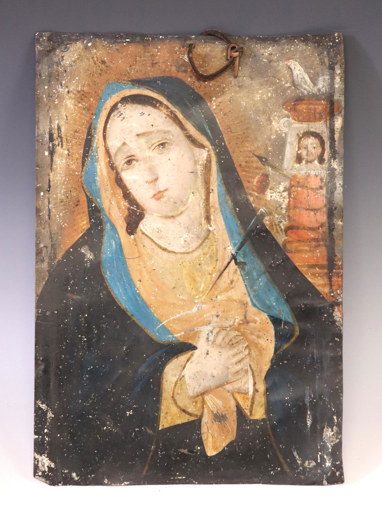 OIL ON TIN RETABLO 'OUR LADY OF SORROWS': Oil on tin retablo, Nuestra Senora de los Dolores (Our Lady of Sorrows), depicting the Virgin Mary, a dagger piercing her heart, Veronica's Veil alongside the Arma Christi/ Instruments of the Passion,
