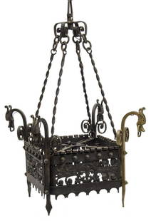 GAUDI STYLE WROUGHT IRON SINGLE-LIGHT CHANDELIER: Wrought iron single-light chandelier, in the manner of Antoni Gaudi (Spanish, 1852-1926), early 20th c., having pierced scrolling frame, suspended by twist supports, stylized dragon at each corner, on