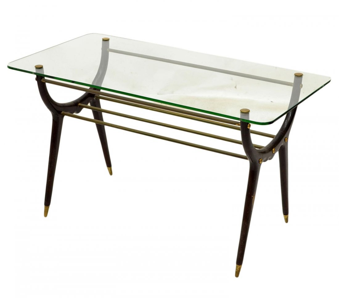 ITALIAN MID-CENTURY WOOD & GLASS COFFEE TABLE: Mid-century modern coffee table in the manner of Osvaldo Borsani, , Italy, c. 1960's/70's, a glass top above gilt metal cross bars, curved wood supports join cylindrical legs terminating in brass caps