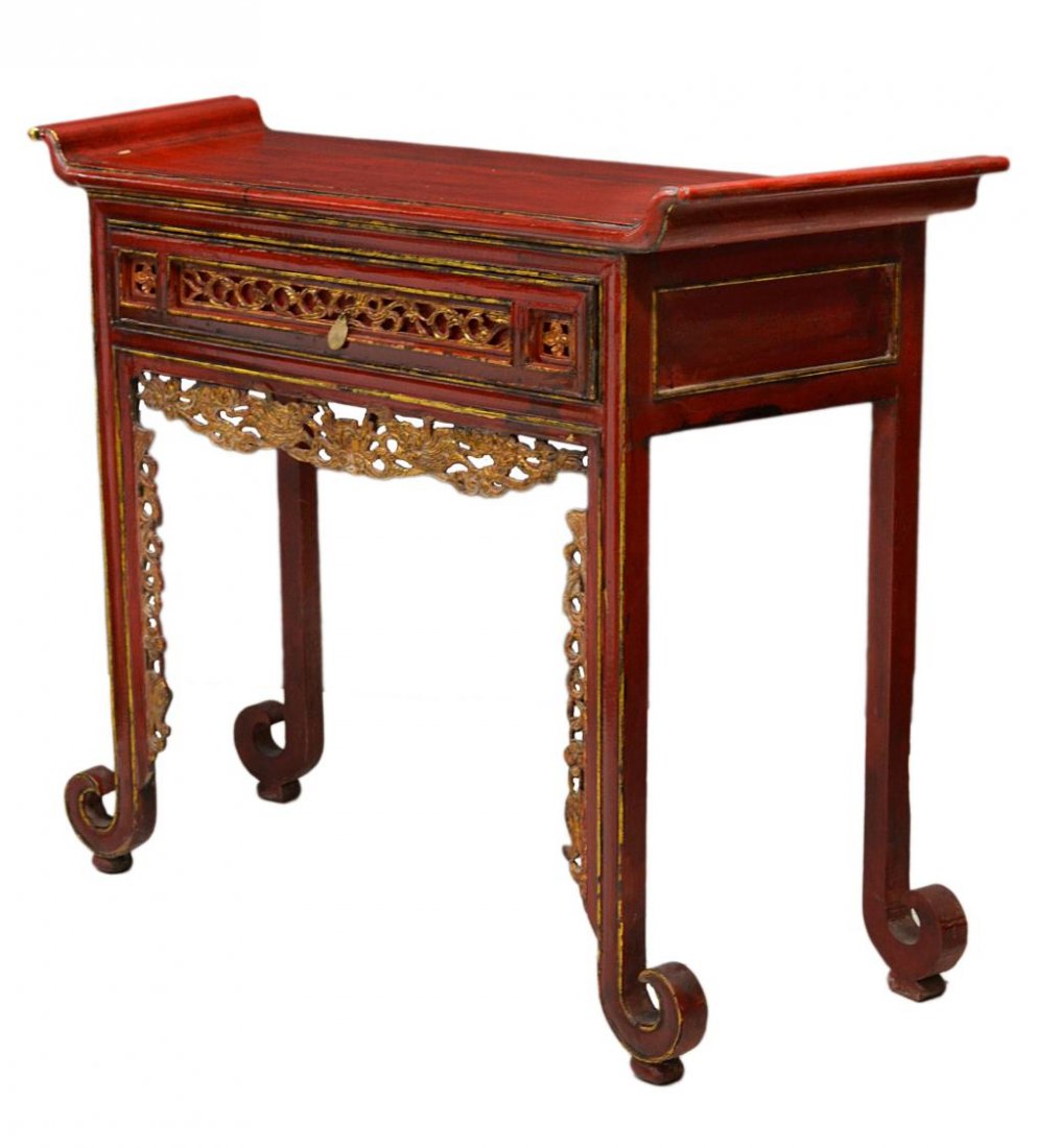 SOUTHEAST ASIAN PARCEL GILT LACQUER ALTAR TABLE: Southeast Asian red lacquer altar table, the rectangular top with up-turned ends above a single drawer and pierced apron, each with gilded pierce carved detail, legs ending in scrolled toe raised on s