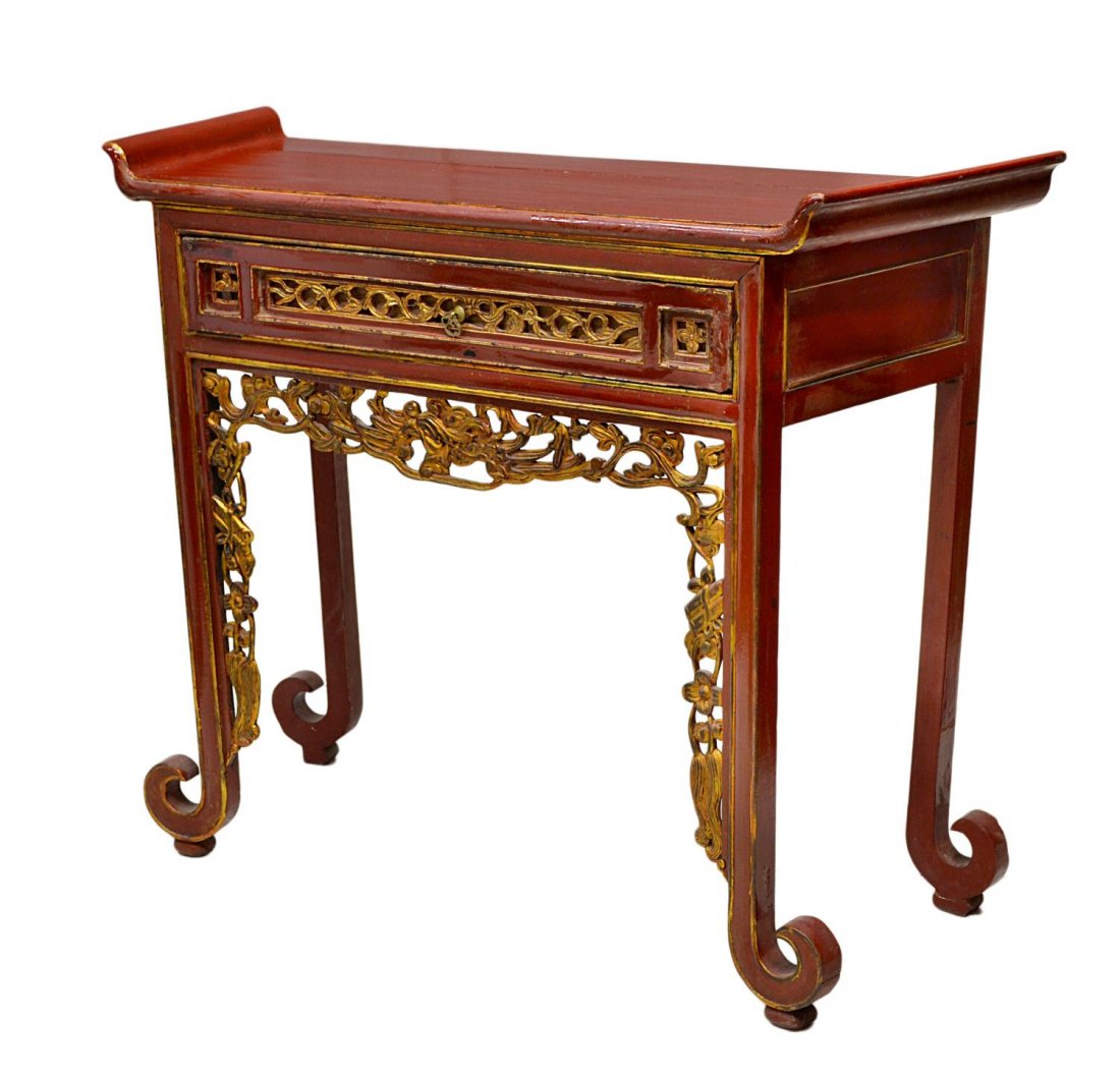 SOUTHEAST ASIAN PARCEL GILT LACQUER ALTAR TABLE: Southeast Asian red lacquer altar table, the rectangular top with up-turned ends above a single drawer and pierced apron, each with gilded pierce carved detail, legs ending in scrolled toe raised on s