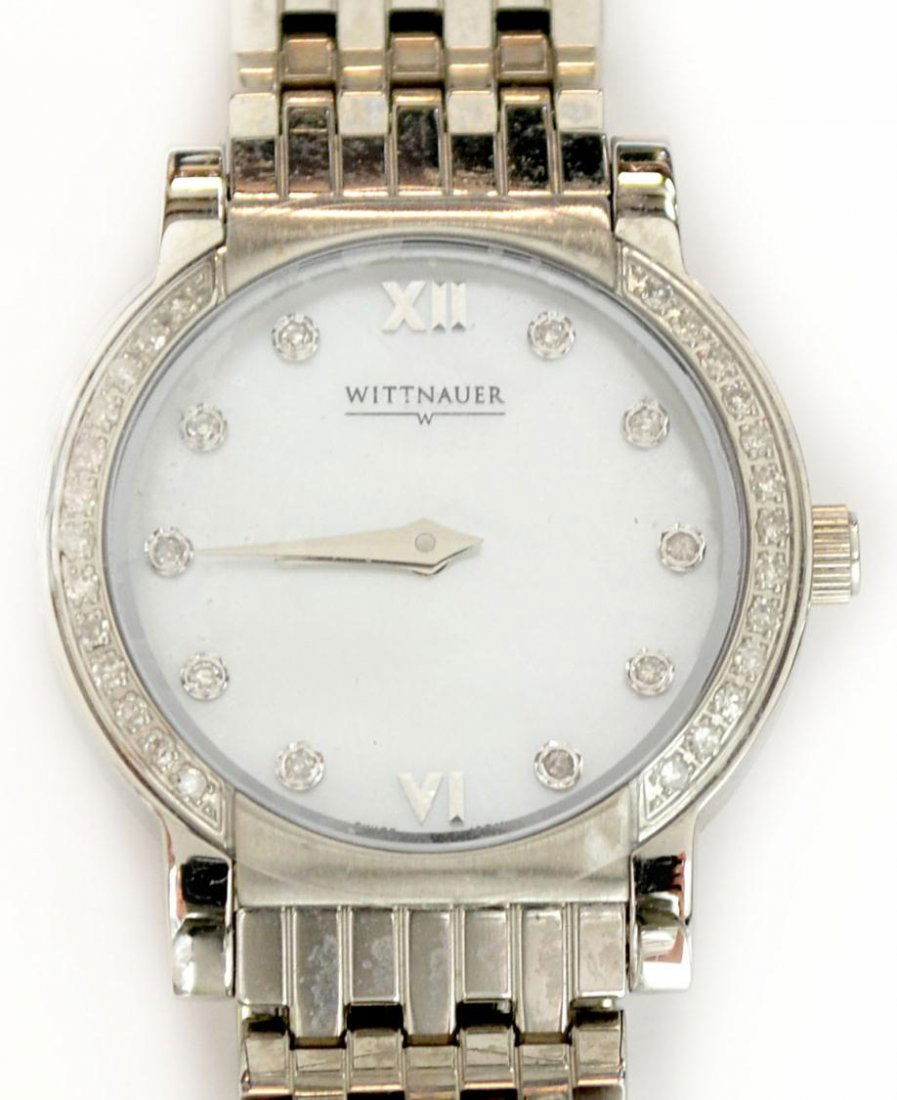 LADIES WITTNAUER STAINLESS & DIAMOND WRISTWATCH: Ladies Wittnauer wristwatch, diamond bezel with textured mother of pearl face, (10) diamonds marking the hours except for roman numerals at 12 and 6 o'clock, stainless steel woven style band, marked '