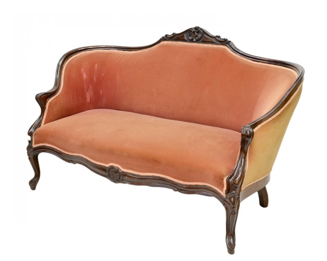 VICTORIAN WALNUT FRAME UPHOLSTERED PARLOR SOFA: Victorian walnut frame parlor sofa, c. 1900, floral carved crest rail over later upholstery, resting on short cabriolet front legs, upholstery in need of cleaning, restoration, 37.75"h, 56.5"w, 25"d *