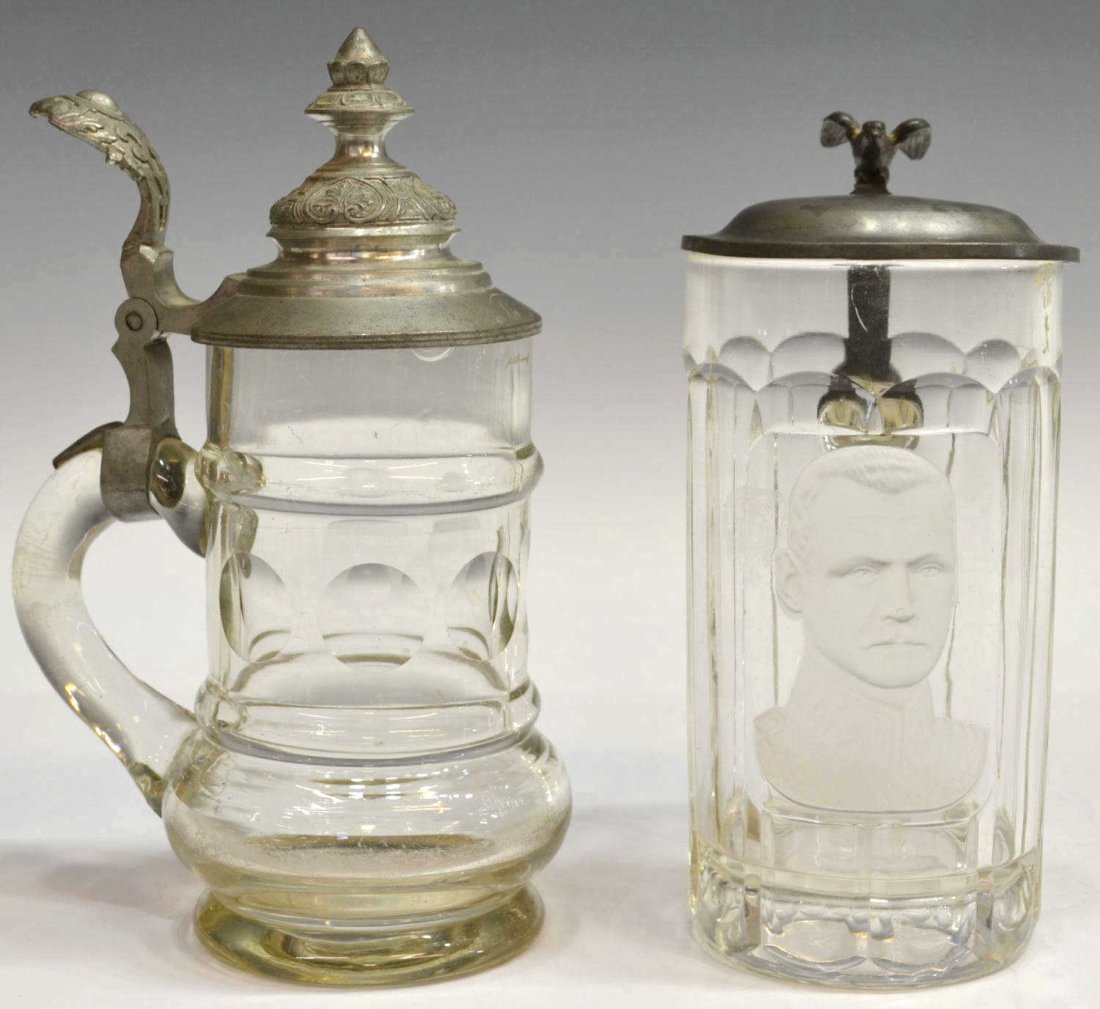 (2) ANTIQUE ENGRAVED GERMAN GLASS STEINS: (lot of 2) German glass steins, comprising: (1) Sächsische Glasfabrik August Walther & Söhne or Sachsenglas stein with a frosted portrait of a stern man in uniform, eagle thumb life often representi