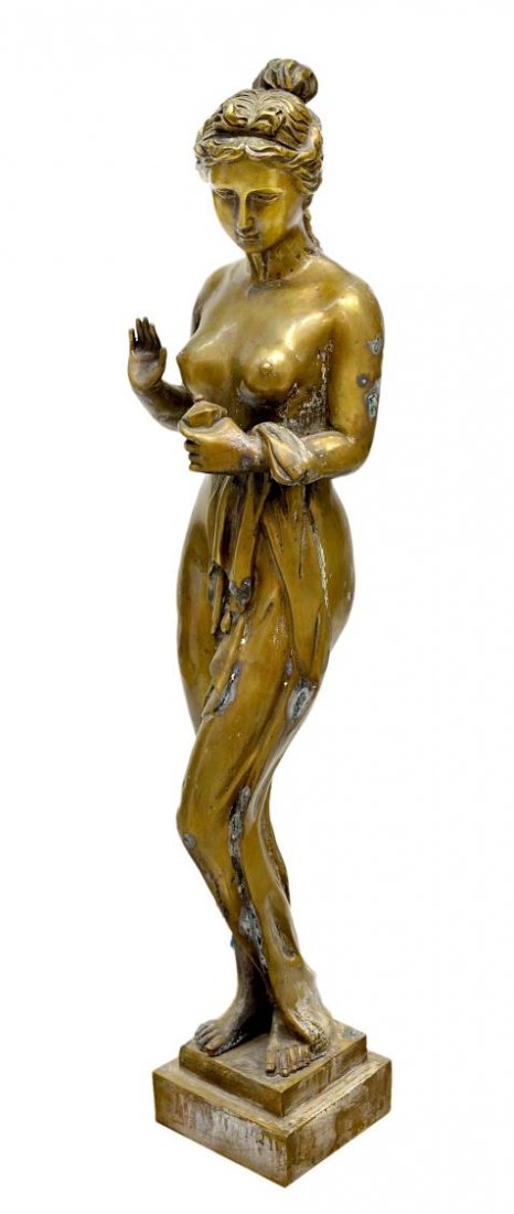 ANTIQUE GARDEN BRONZE, A DRAPED FEMALE NUDE: Figural garden bronze modeled as a partially draped nude beauty, her wavy hair pulled into a bun with bow, weather/ oxidation as pictured, 34.5"h, 5.75"w (8C167) Start Price: $50.00