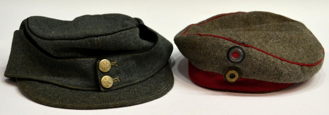 (2) GERMAN MILITARY HEADWEAR: (lot of 2) German military caps: (1) pill box gray wool with red piping and band, two insignias, marked 57-1/4 (size), style of 1910; (1) light green wool visor cap, pebbled button with cross, size 57