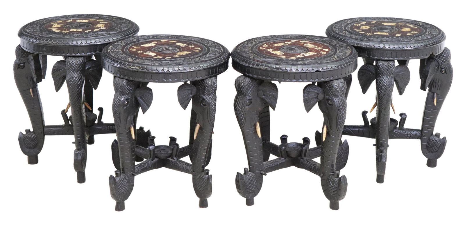 (4) CARVED & EBONIZED ELEPHANT-LEG STOOLS, INDIA: (lot of 4) Carved and ebonized hardwood stools, India, 20th c., round top with figural bone inlay, rising on elephant-form supports, joined with center stretcher, approx 18"h, 17"diam Start Price: $25