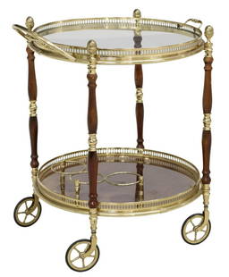 FRENCH ROUND BRASS & WOOD SERVICE BAR CART: French brass and wood service/ bar cat, 20th c., barrel-form, with pinecone finials, removable handled tray, rising on turned supports, over lower tier with three bottle rack, ending on casters, appro