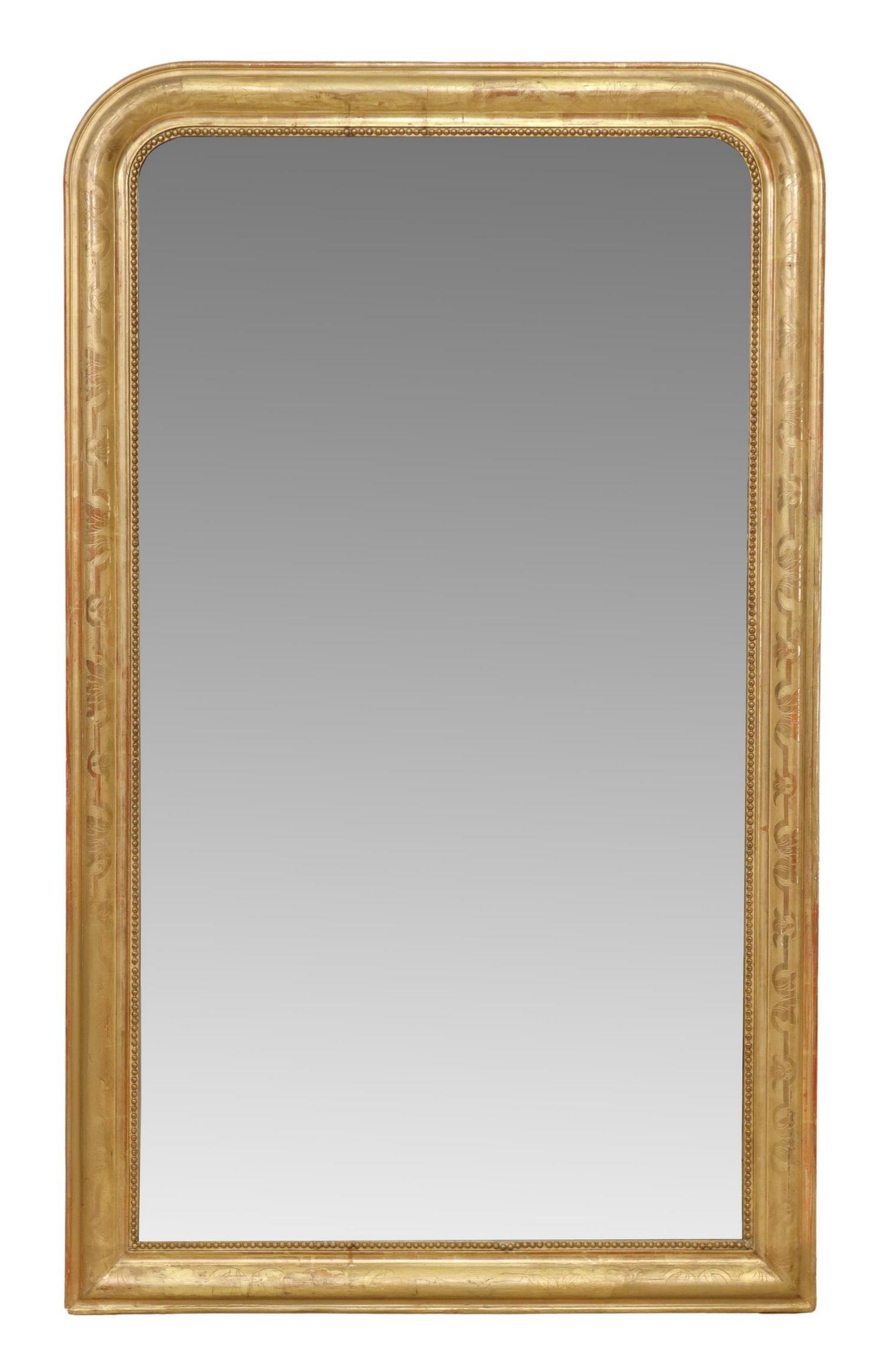 FRENCH LOUIS PHILIPPE PERIOD GILTWOOD MIRROR: French Louis Philippe period giltwood mirror, mid 19th c., having arched frame with incised foliate motifs, beaded trim, encasing flat mirror plate, some silver loss to mirror plate, approx 55"h, 32.5