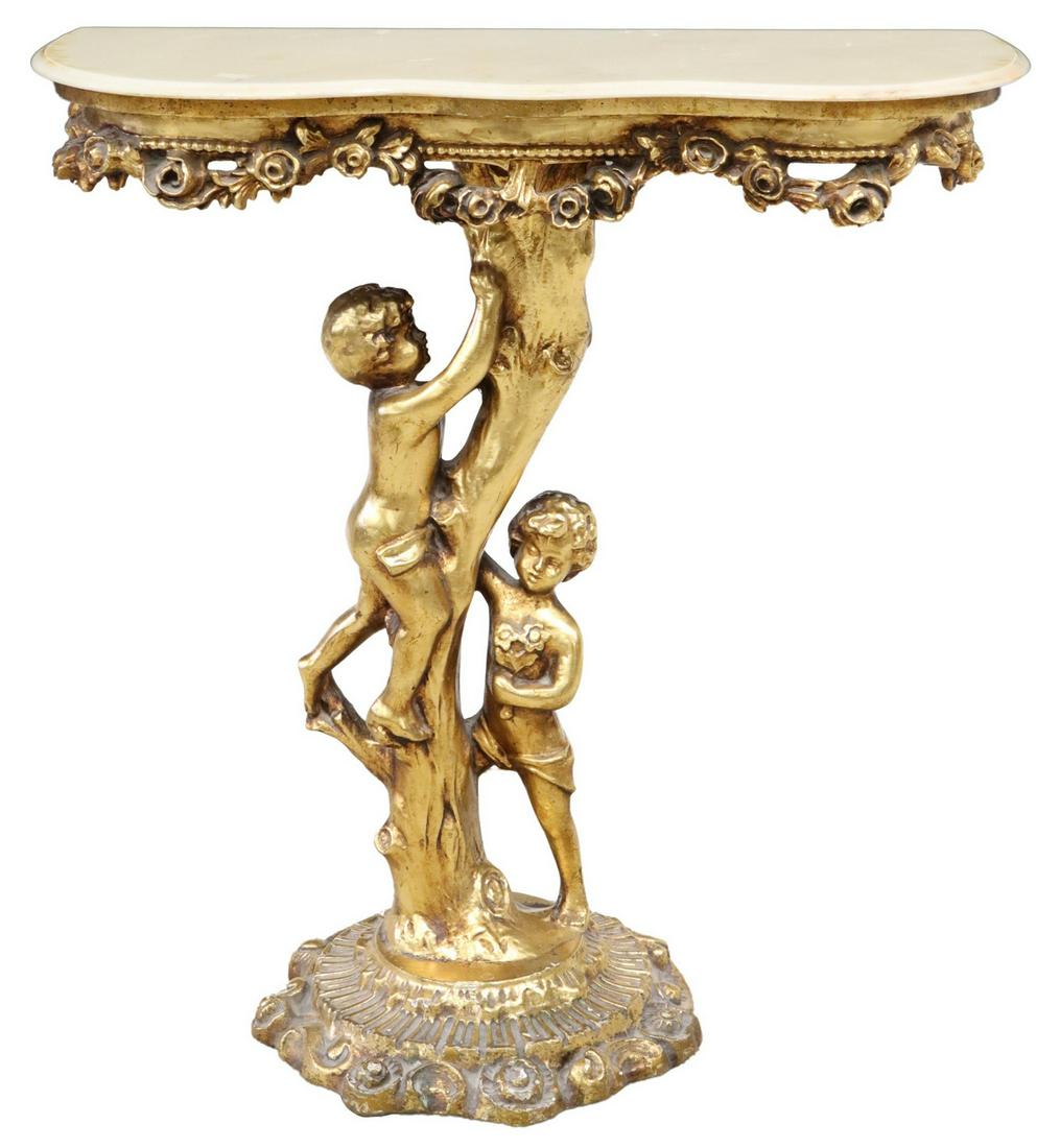 ITALIAN LOUIS XV STYLE STONE-TOP GILT CONSOLE: Italian Louis XV style gilt console table, 20th c., shaped stone top, floral apron, faux bois standard, with two putti, rising on carved round base, small repair to top at molded edge, approx 31"h, 29