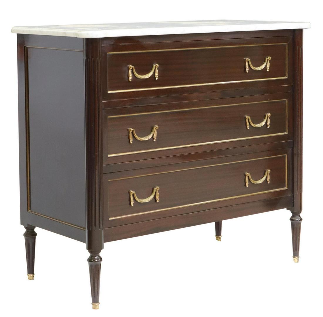 FRENCH LOUIS XVI STYLE MARBLE-TOP MAHOGANY COMMODE: French Louis XVI style marble-top mahogany commode, 20th c., three drawers framed by fluted corner posts, on tapering legs, approx 33.5"h, 37.25"w, 18.5"d Start Price: $400.00
