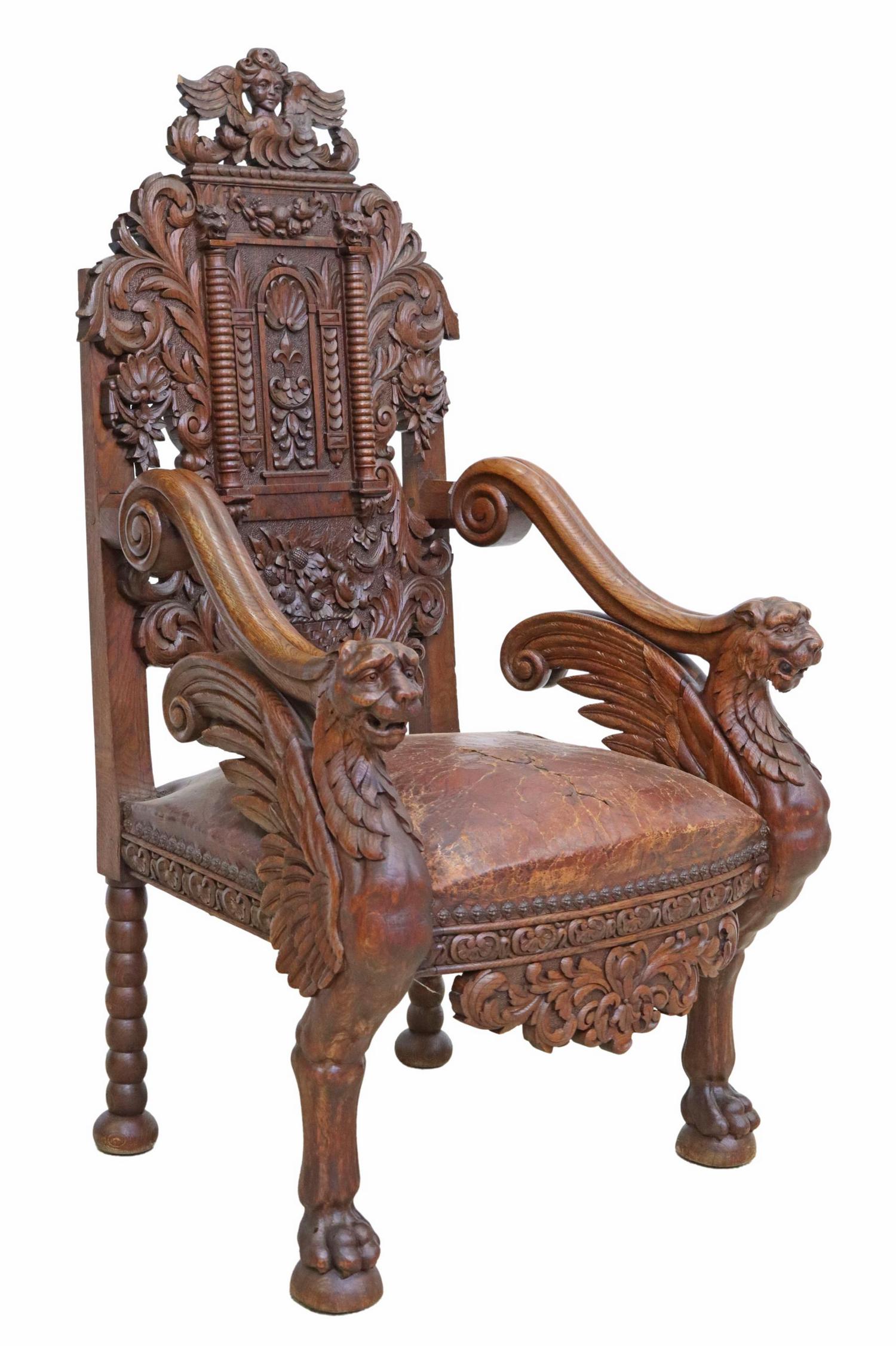 RENAISSANCE REVIVAL OAK WINGED LIONS FAUTEUIL: Fine Renaissance Revival oak armchair, chair back signed V. Lafuge, well-carved back with winged putto mask, rocaille and foliate scrolls, worn leather seat, scrolled armrests supported by winged lion