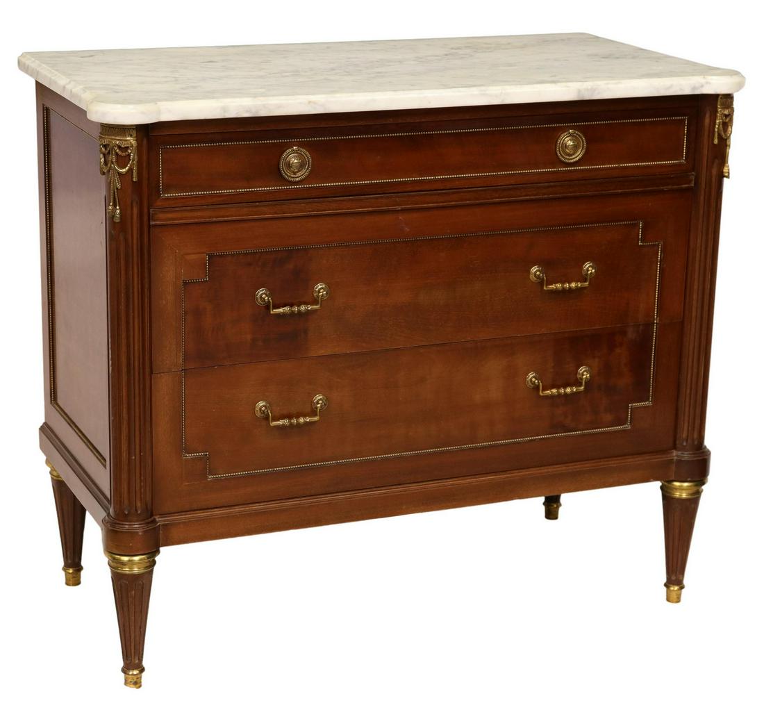 FRENCH LOUIS XVI STYLE MARBLE-TOP MAHOGANY COMMODE: French Louis XVI style marble-top mahogany commode, 20th c., three drawers, on tapering fluted supports, approx 33.75"h, 39.5"w, 19.75"d Start Price: $600.00