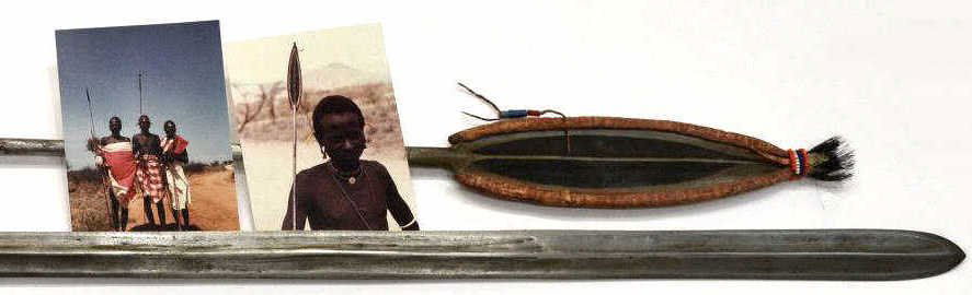VINTAGE AFRICAN SPEARS & ORIGINAL MASSAI PHOTOS: (lot of 4) Two African spears, Masai Tribe, Kenya, accompanied by two original photos of tribal members who presented the spears to Mr. Max Gordon, c. 1978: (1) having beaded worn leather sheath, natu